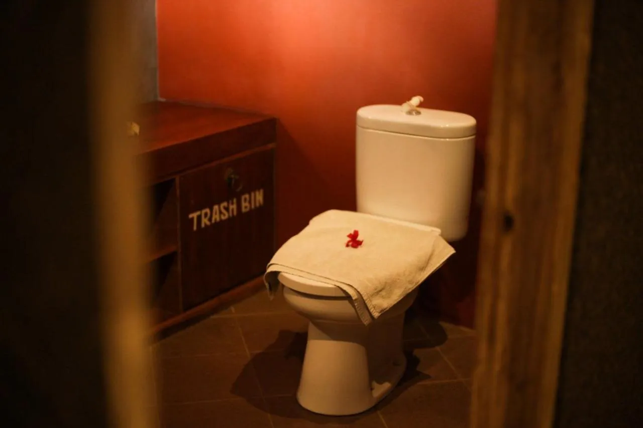 Toilet in Kubuku Eco Dive Lodge and Yoga