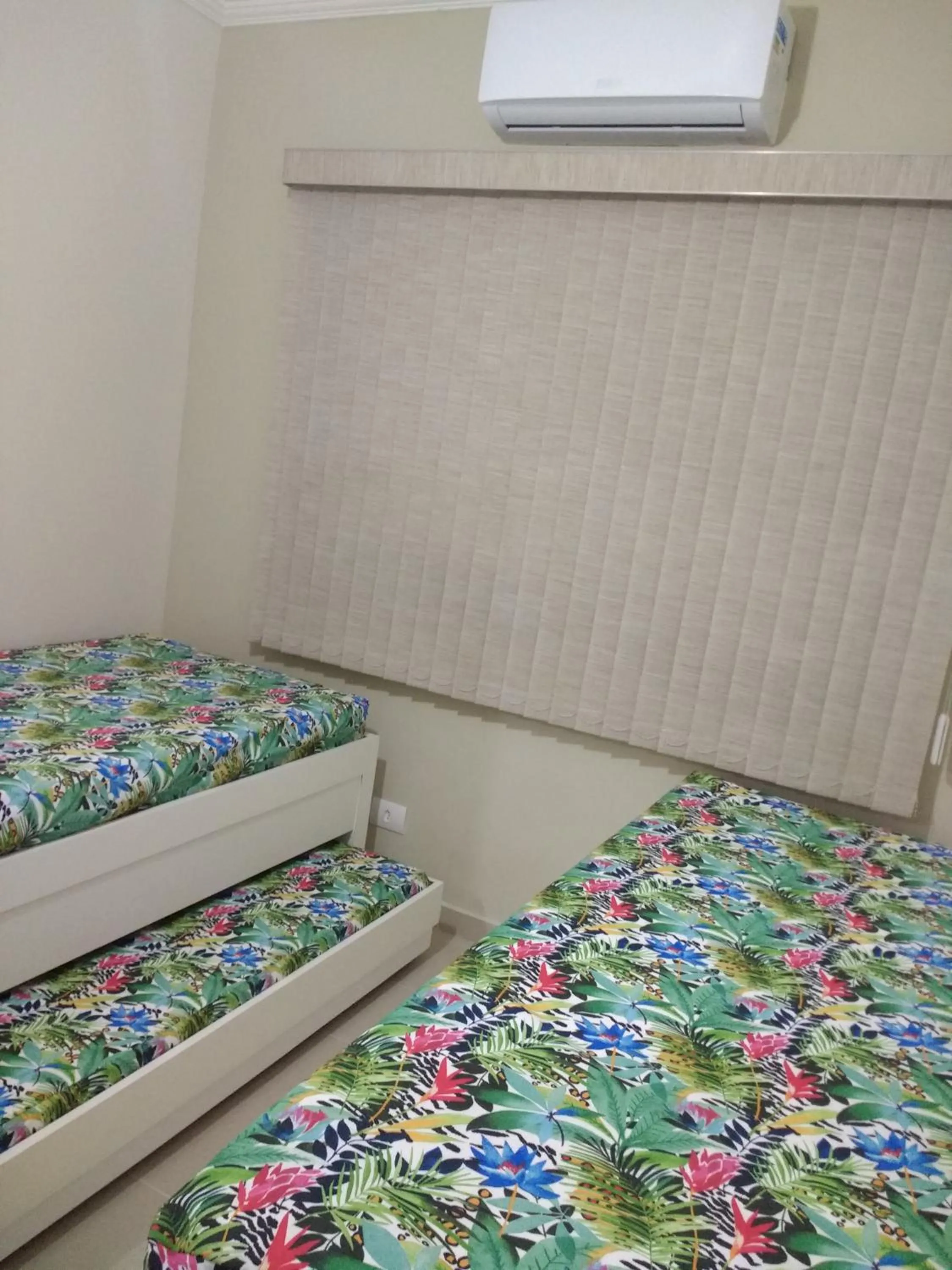 Bed in Apartamento Enseada Guarujá