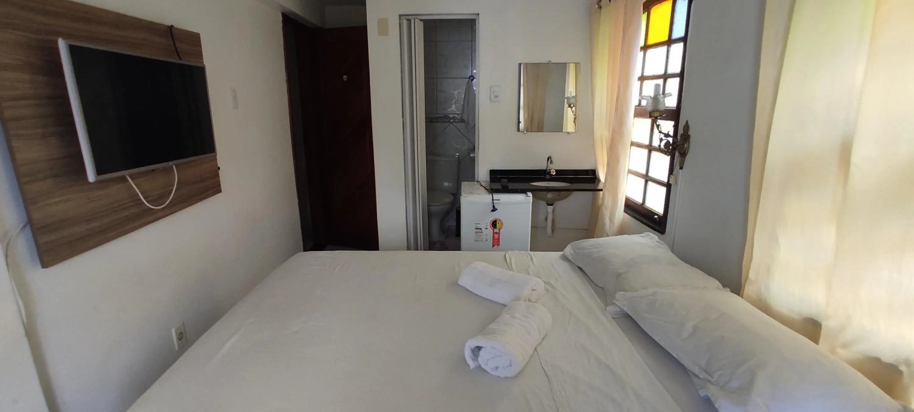 Bed in Pousada Zumbi dos Palmares