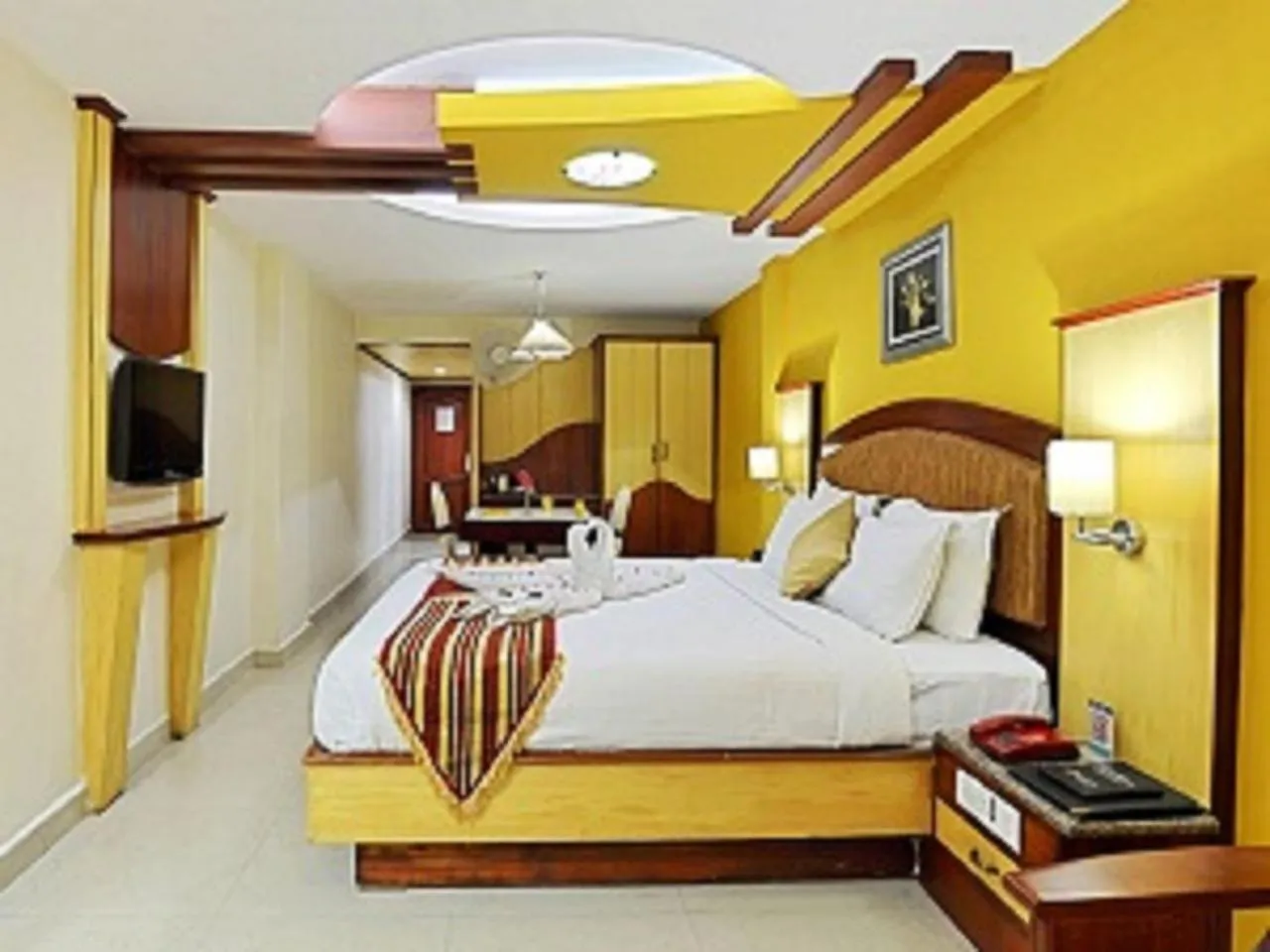 Communal lounge/ TV room, Bed in PonmariResidency