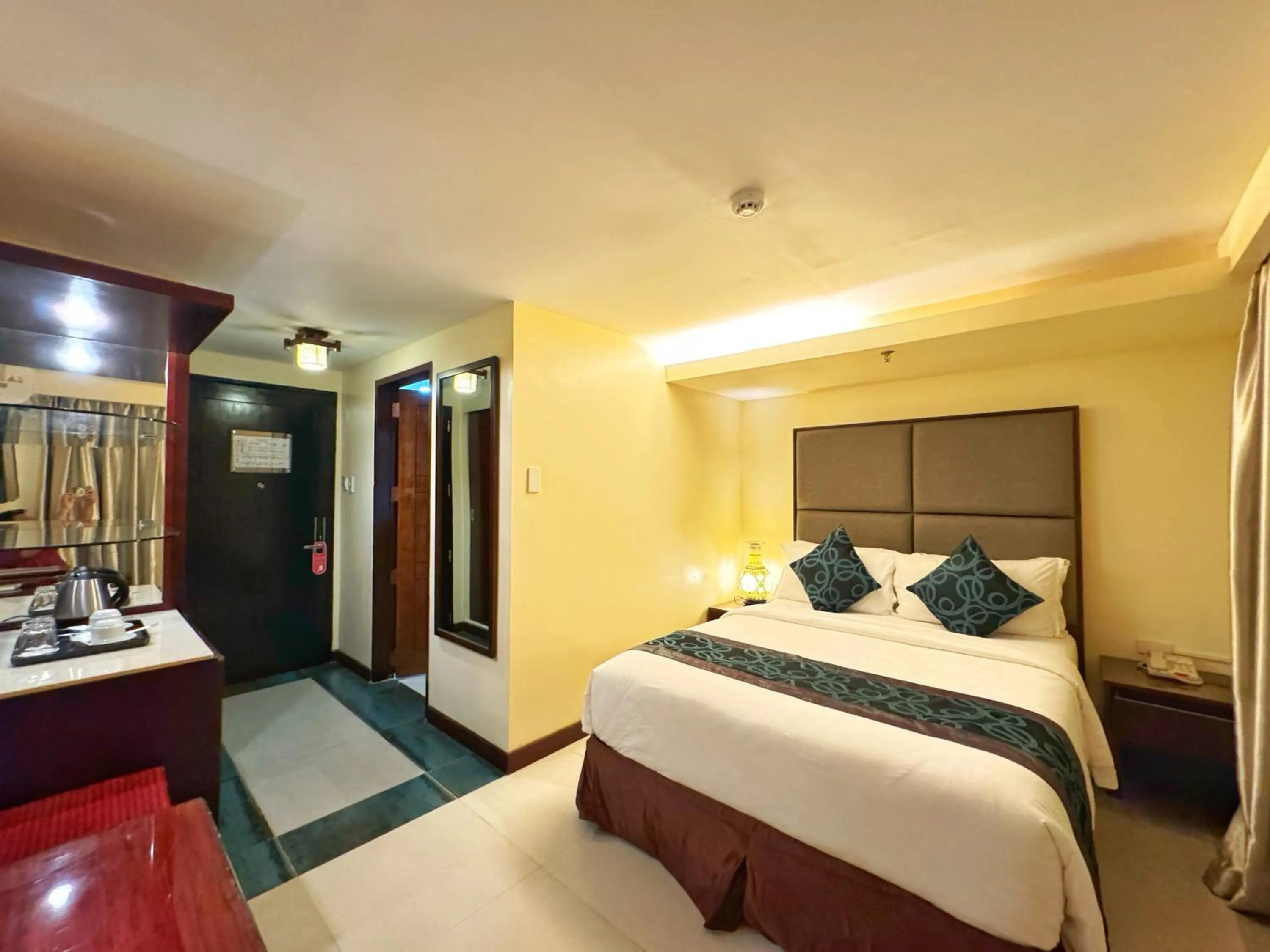 Bed in Golden Phoenix Hotel Boracay