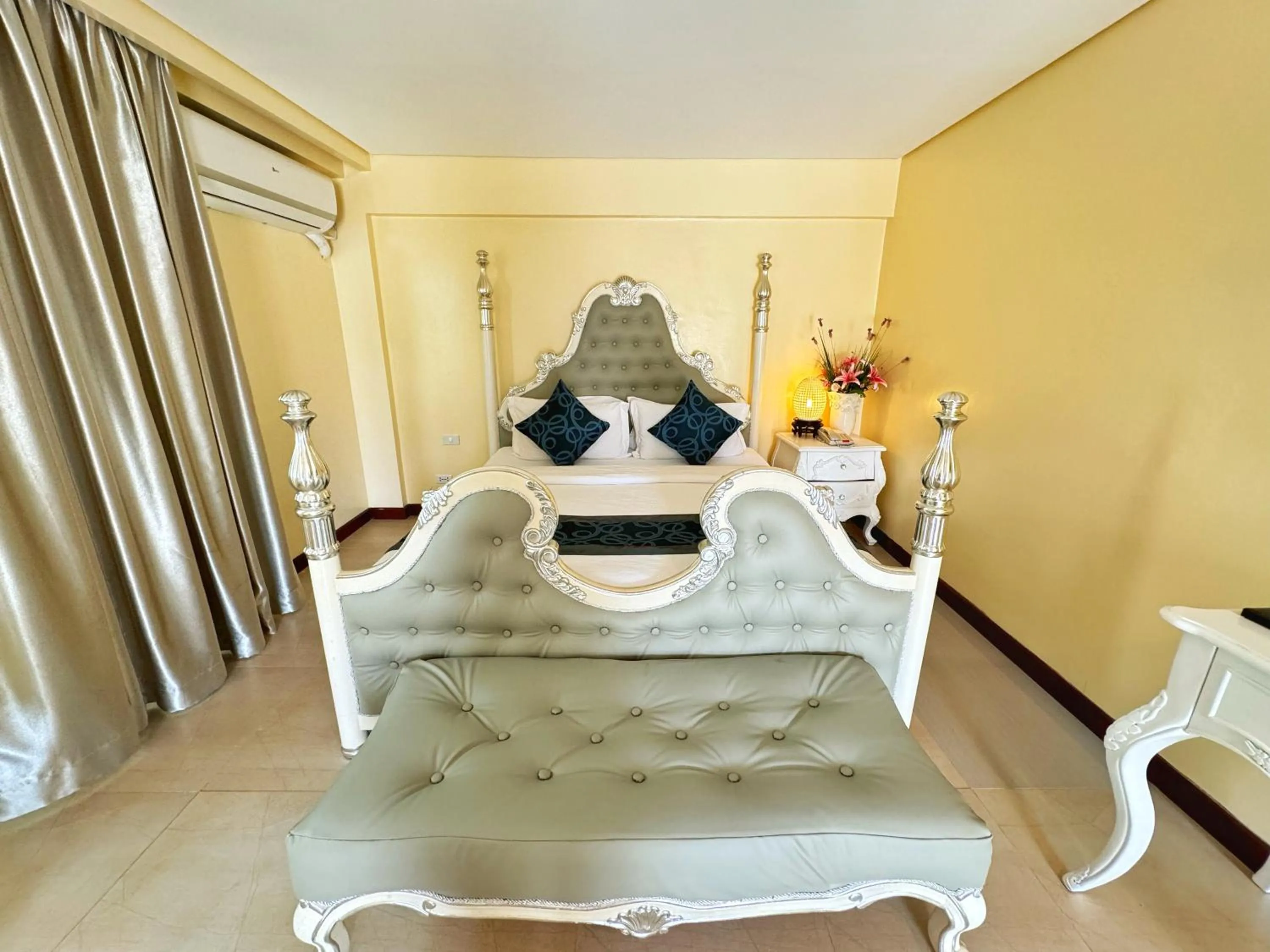 Bed in Golden Phoenix Hotel Boracay