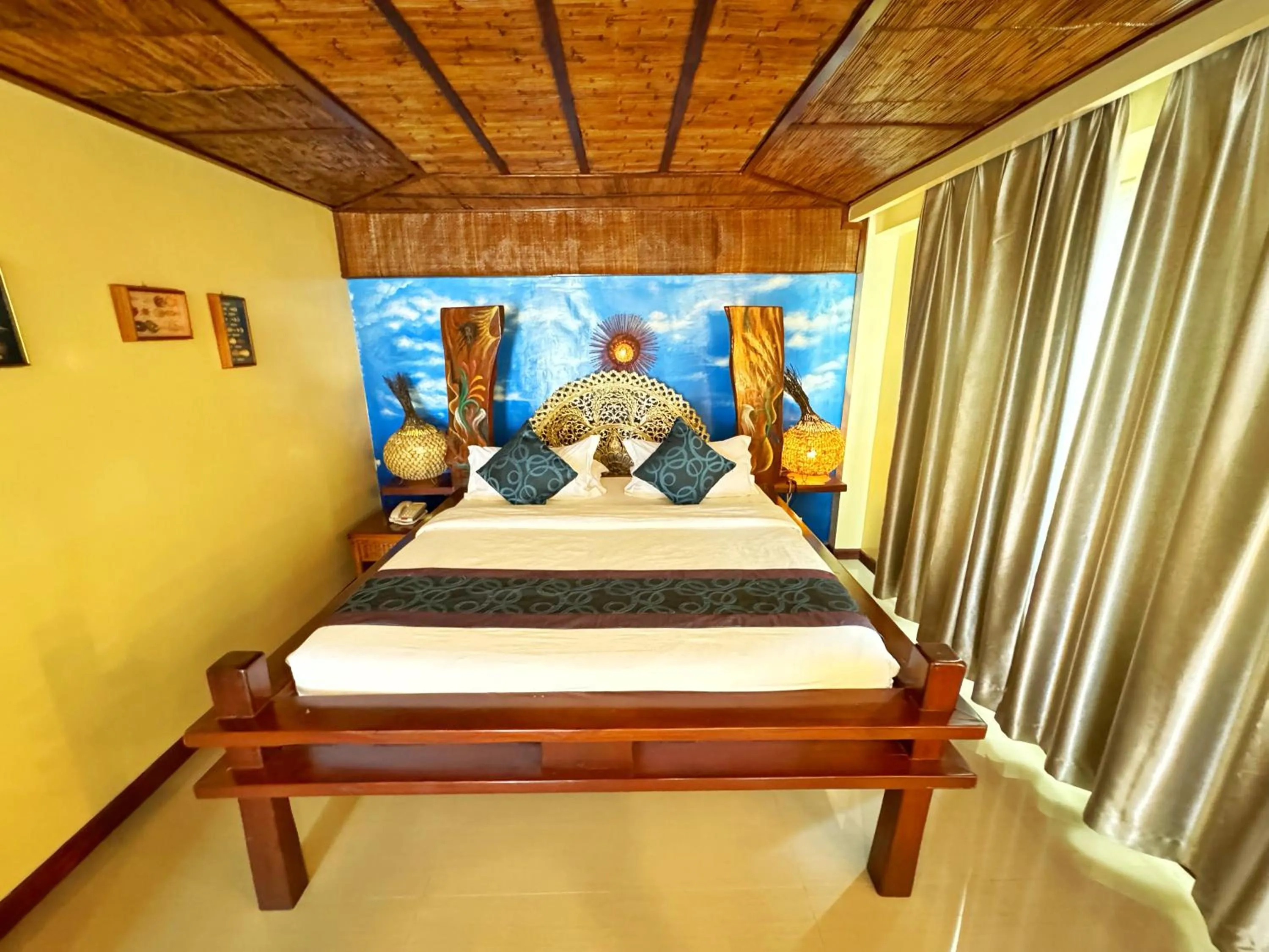 Bed in Golden Phoenix Hotel Boracay