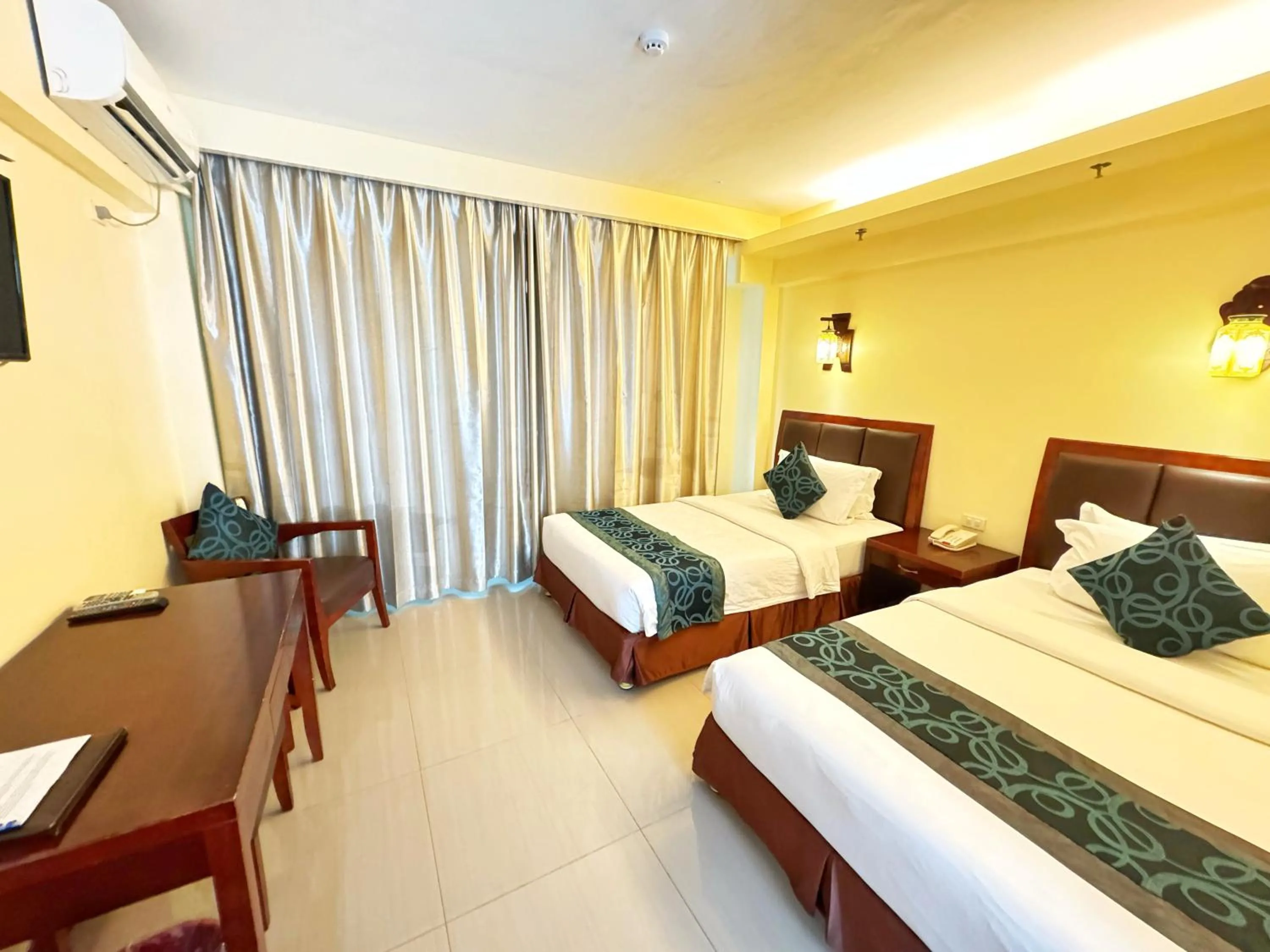 Bed in Golden Phoenix Hotel Boracay