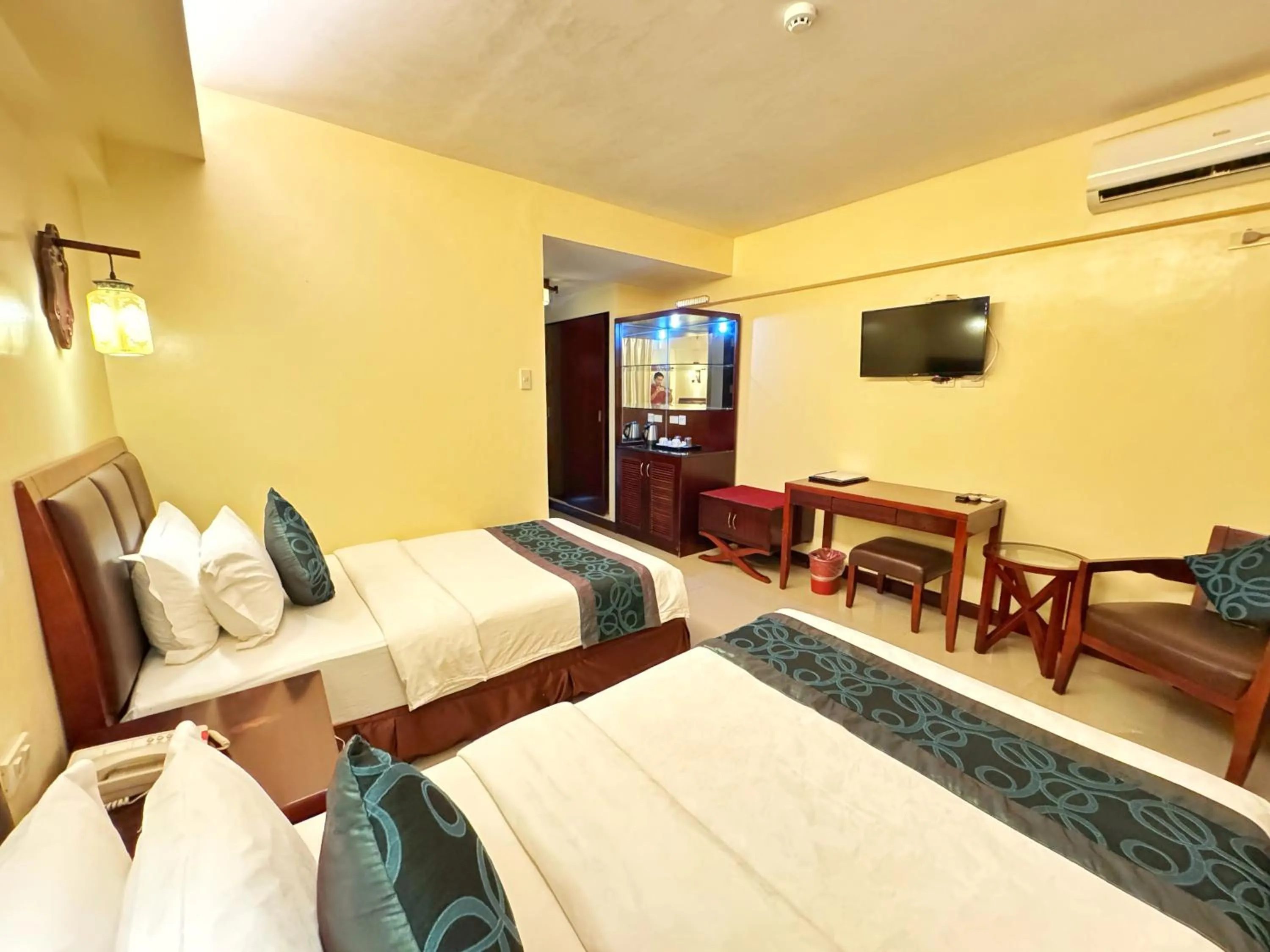 Bed in Golden Phoenix Hotel Boracay