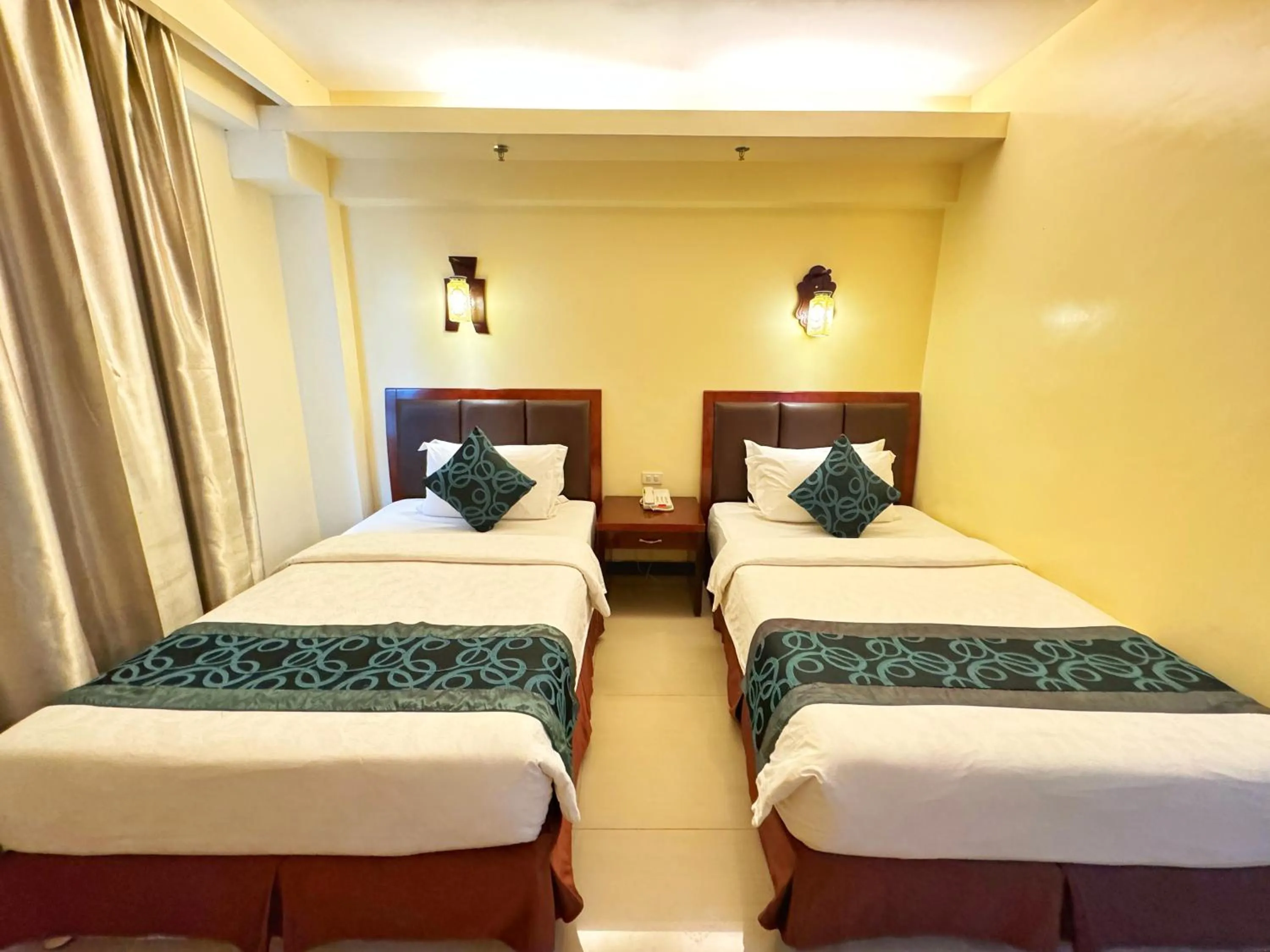 Bed in Golden Phoenix Hotel Boracay