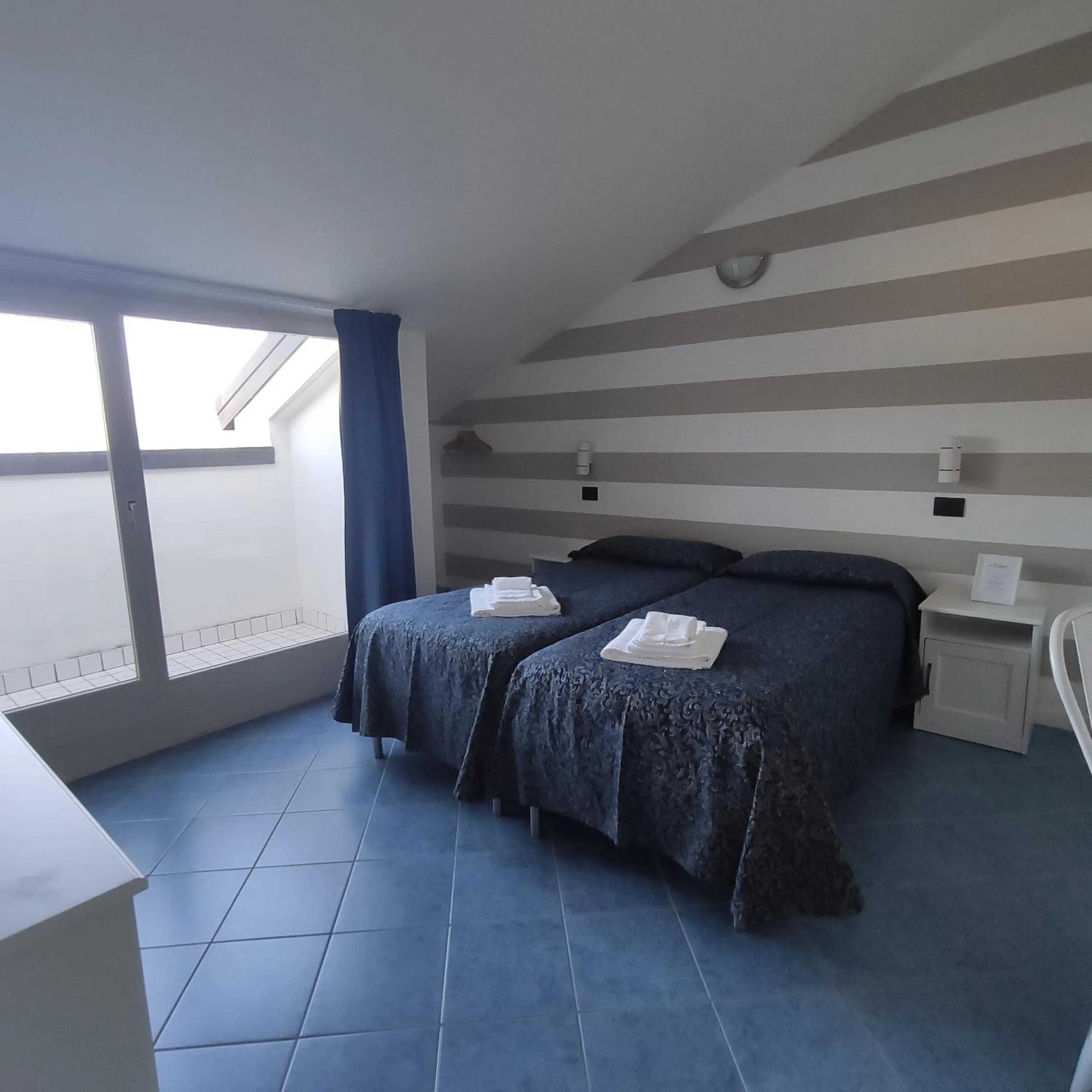 Bedroom in Hotel La Fontana