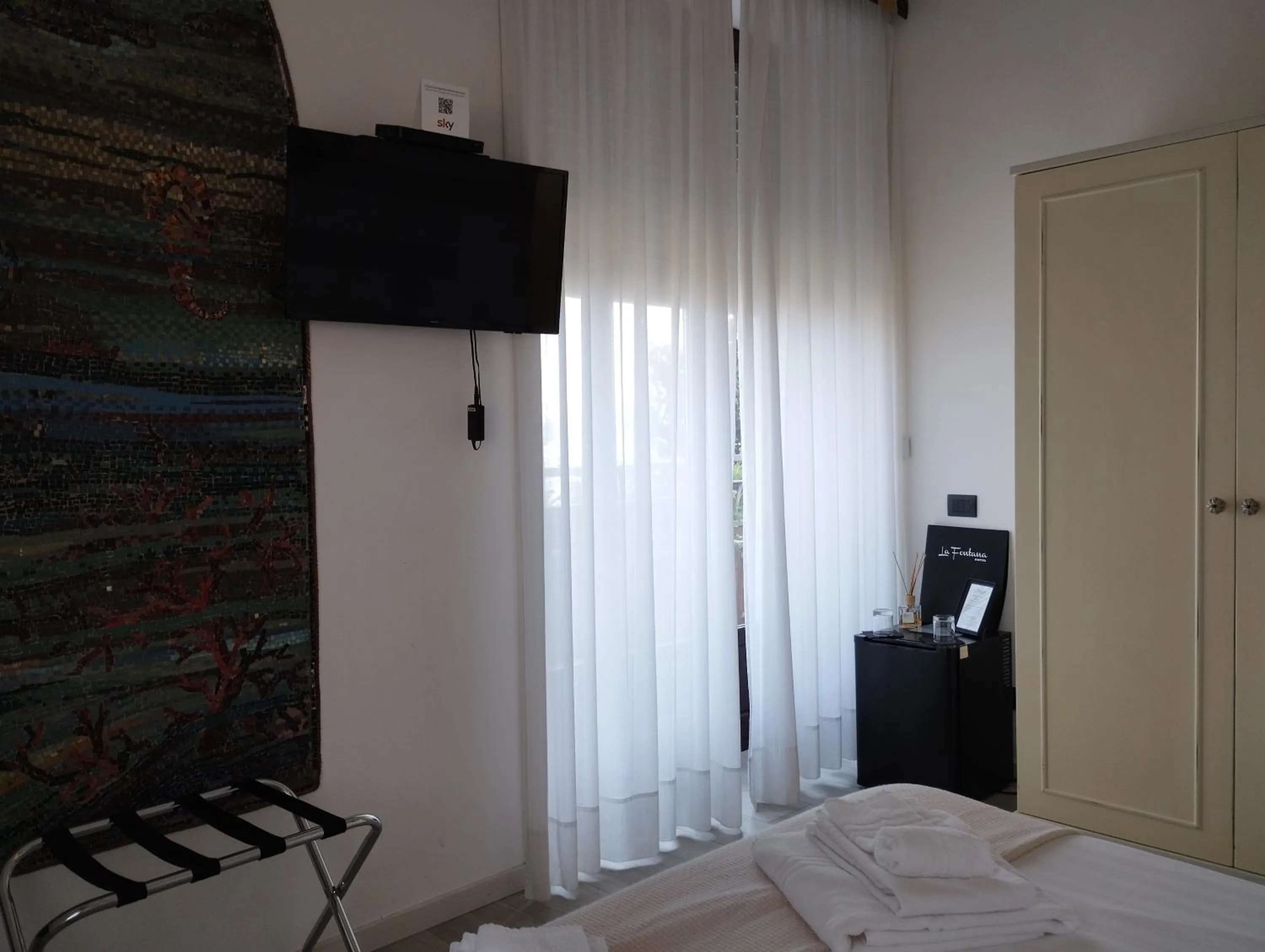 Bedroom in Hotel La Fontana