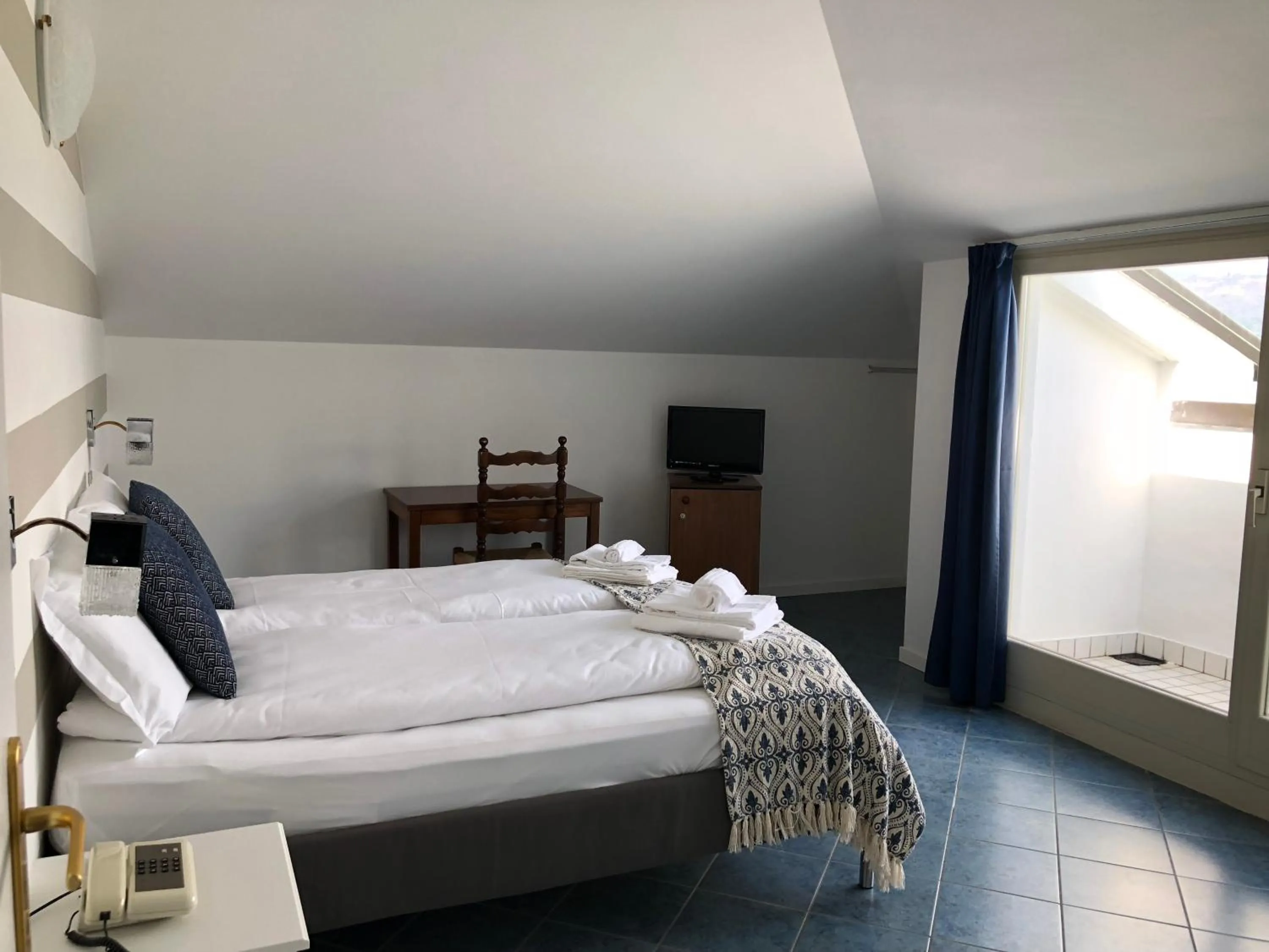 Bedroom in Hotel La Fontana