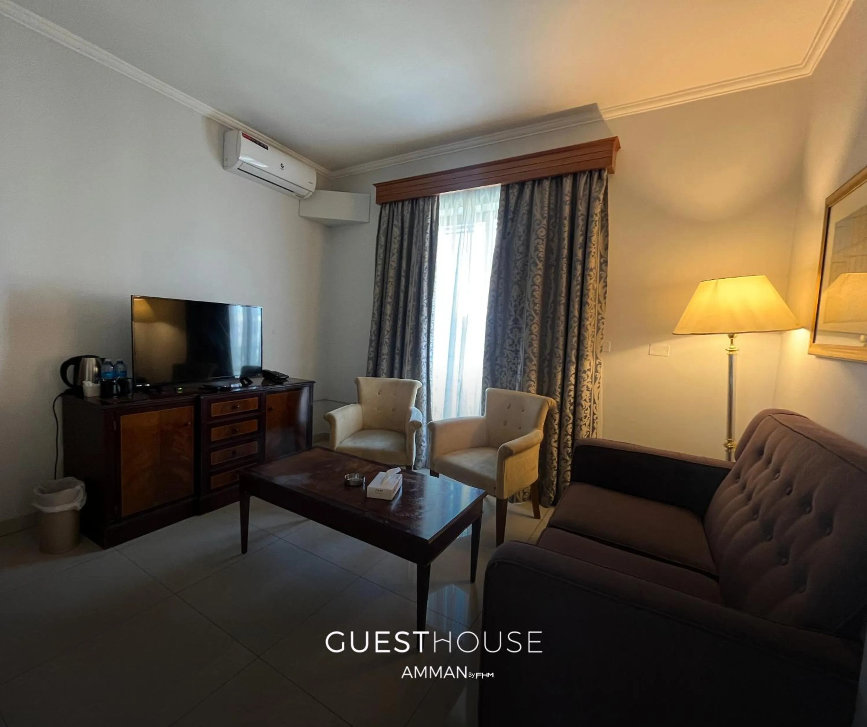 Seating area in Guest House Hotel Amman by FHM