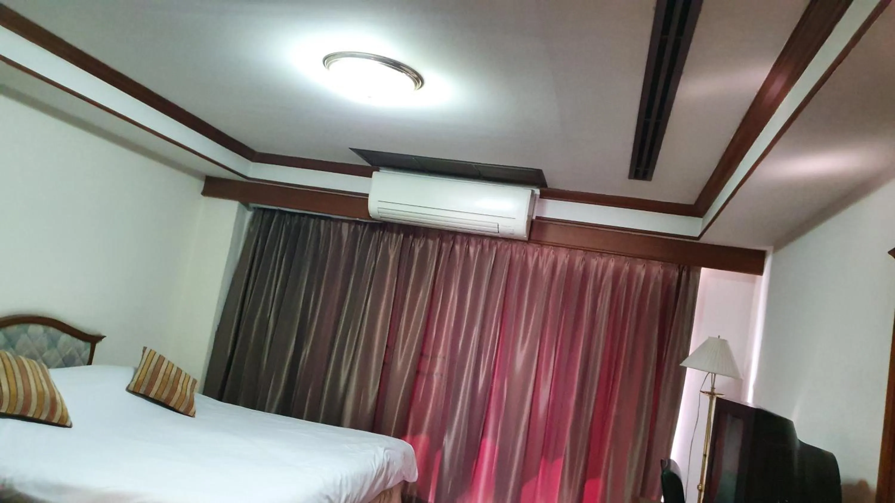 Decorative detail, Bed in Interchange Tower Serviced Apartment - SHA Extra Plus
