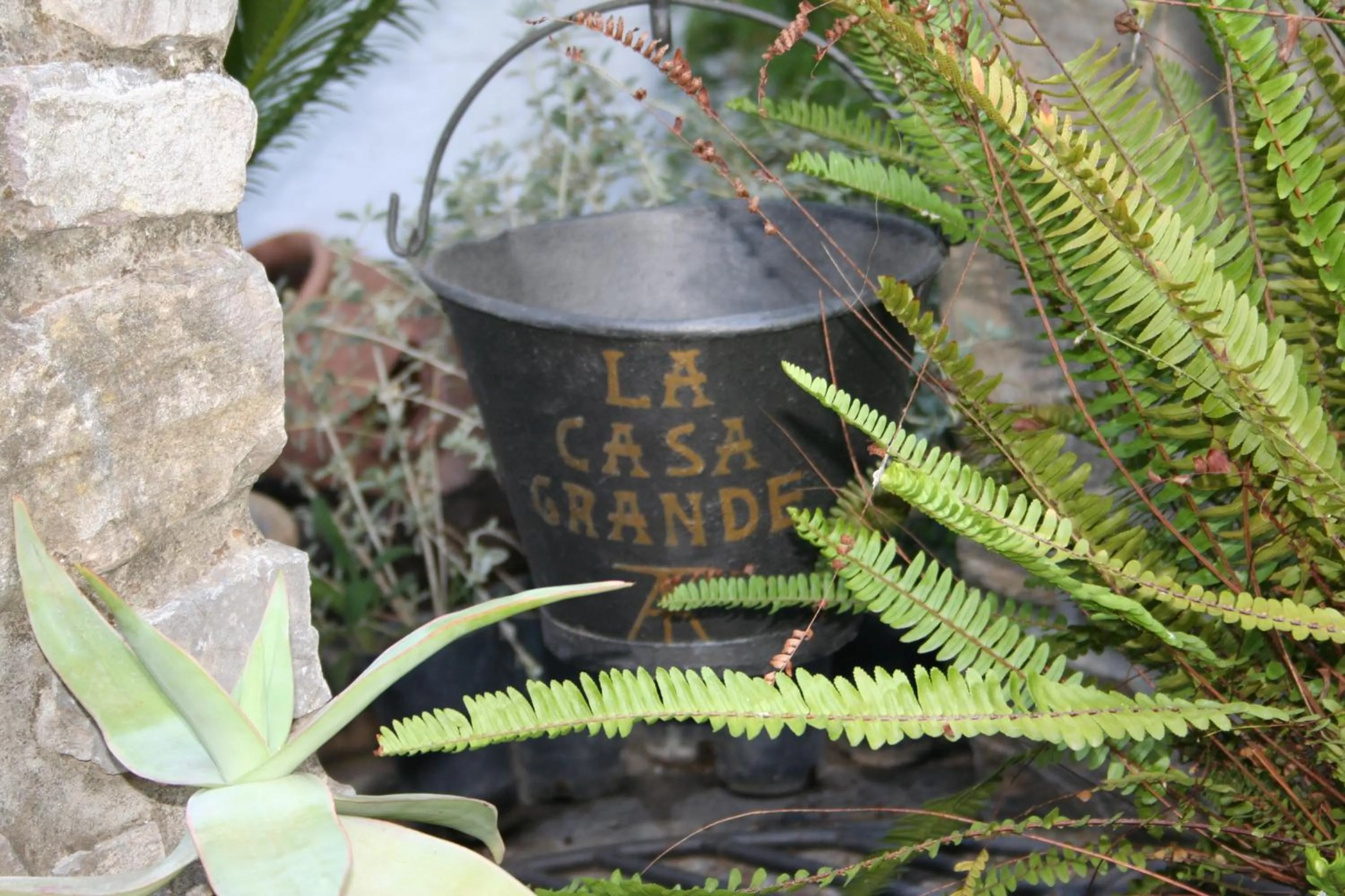 Property logo or sign in Posada La Casa Grande
