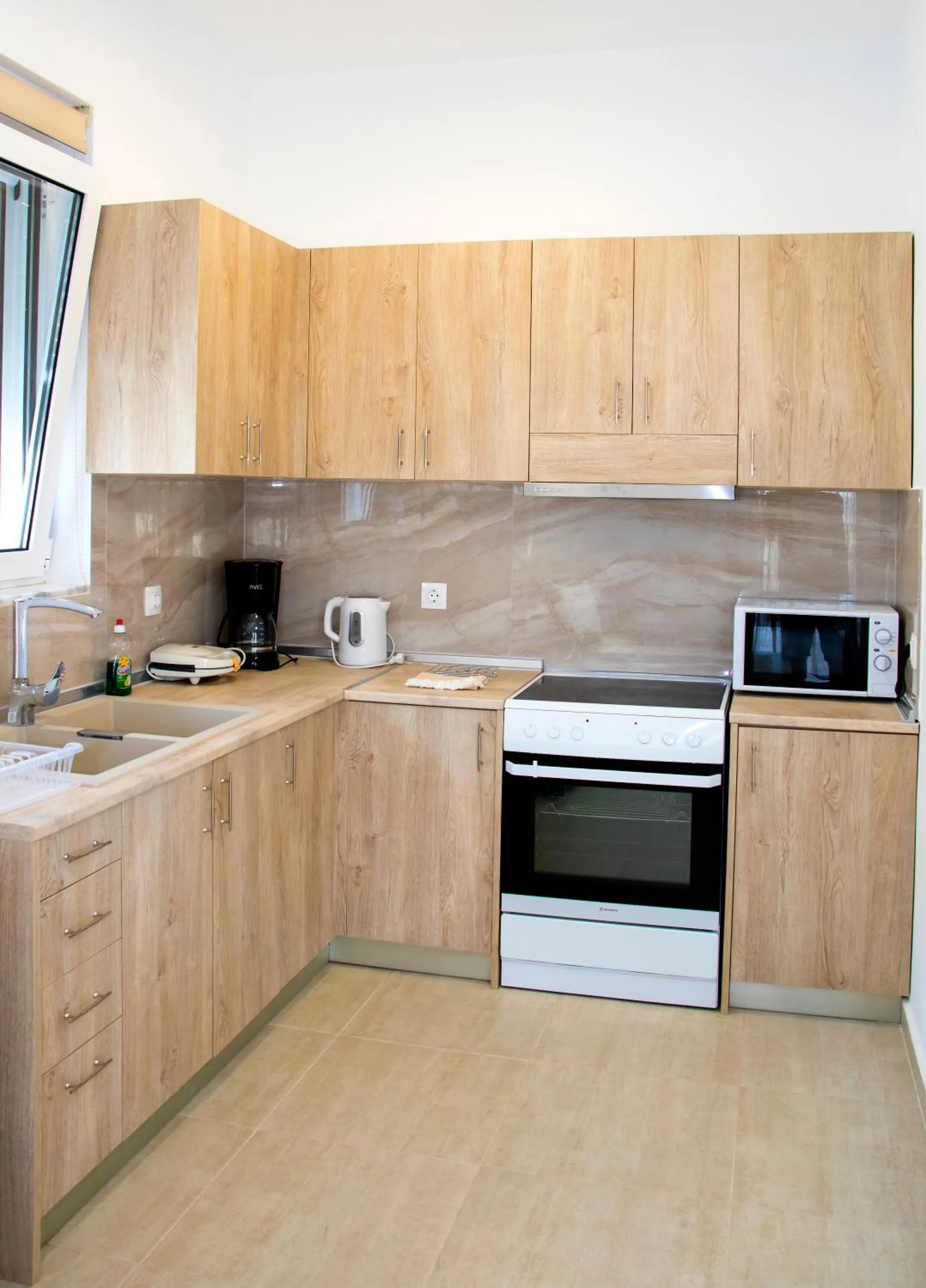 Kitchen or kitchenette in Gennadi Gardens exclusive apartments