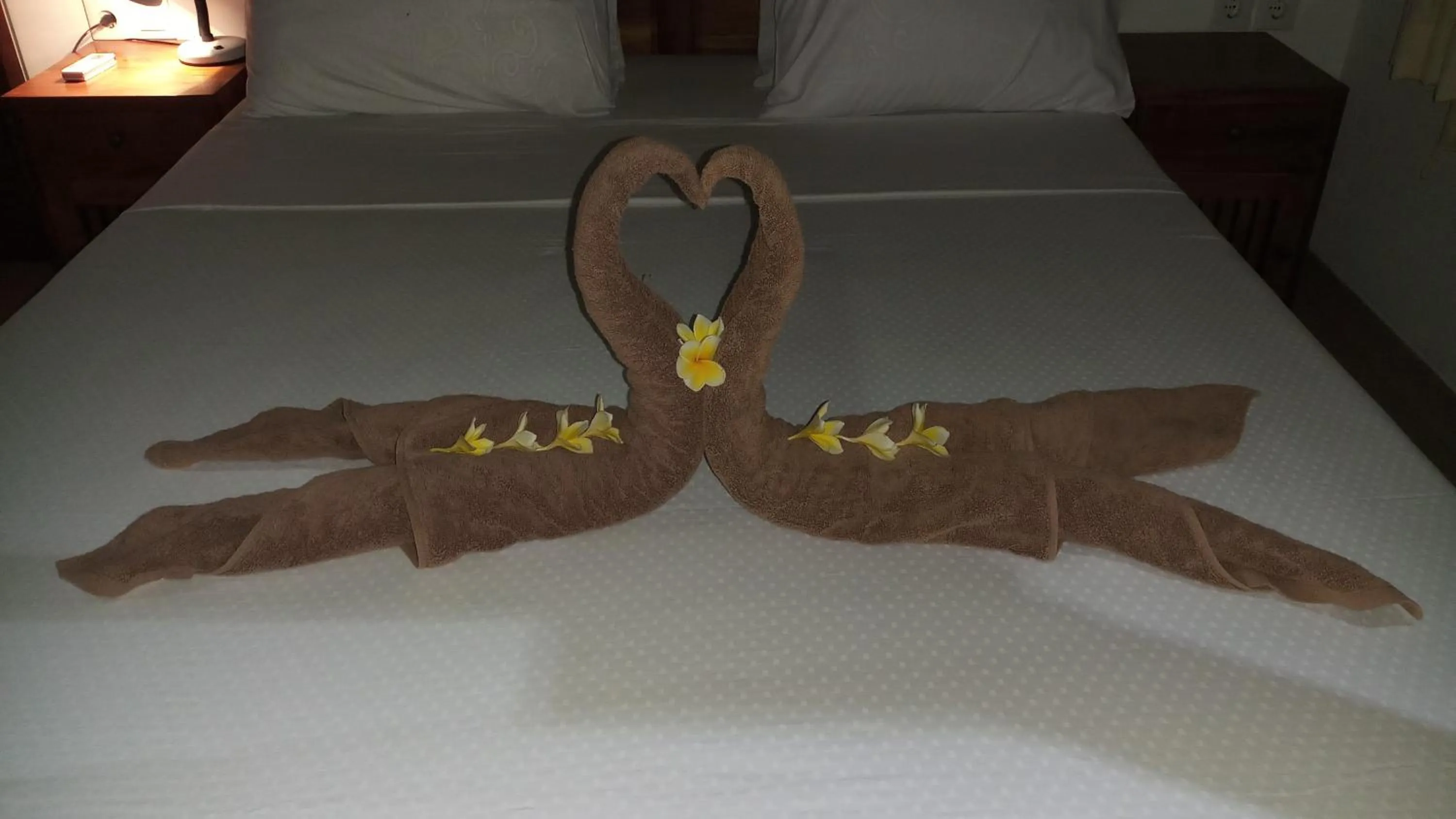 Bed in Jemeluk Beach Bungalows