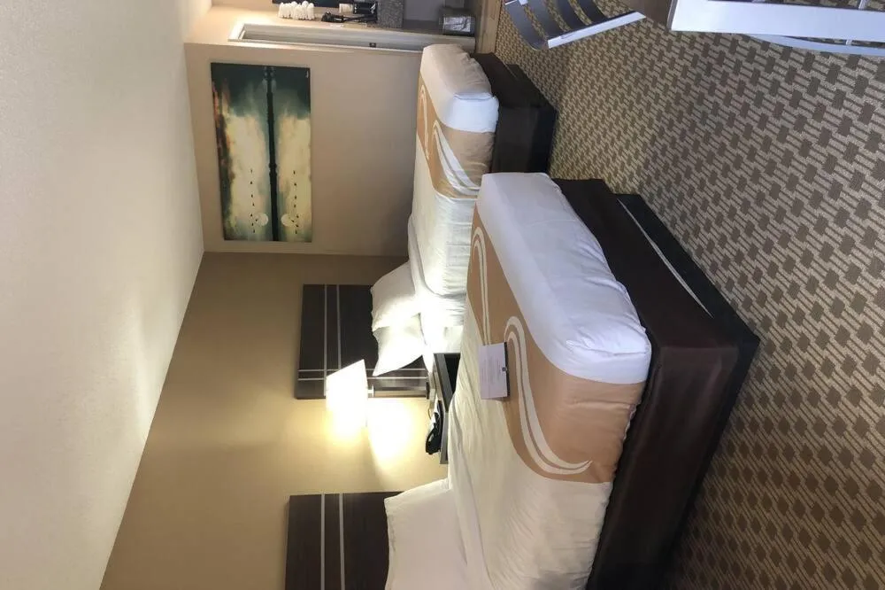 Bed in Quality Inn Madisonville