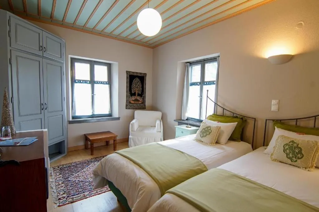 Bed in Kyriaki Guesthouse & Suites