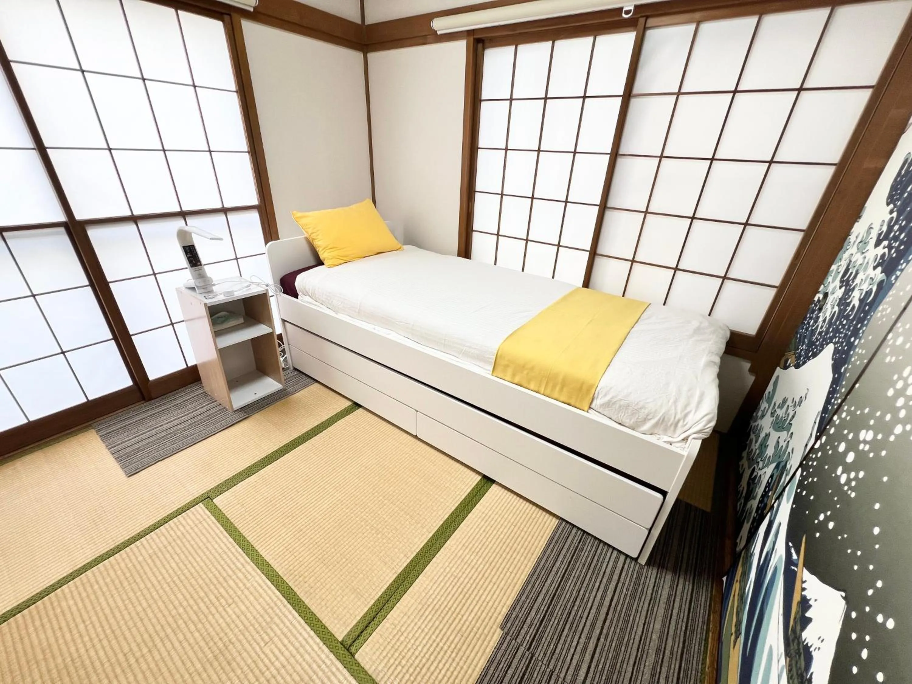 Bed in Ikebukuro no Yado detached house