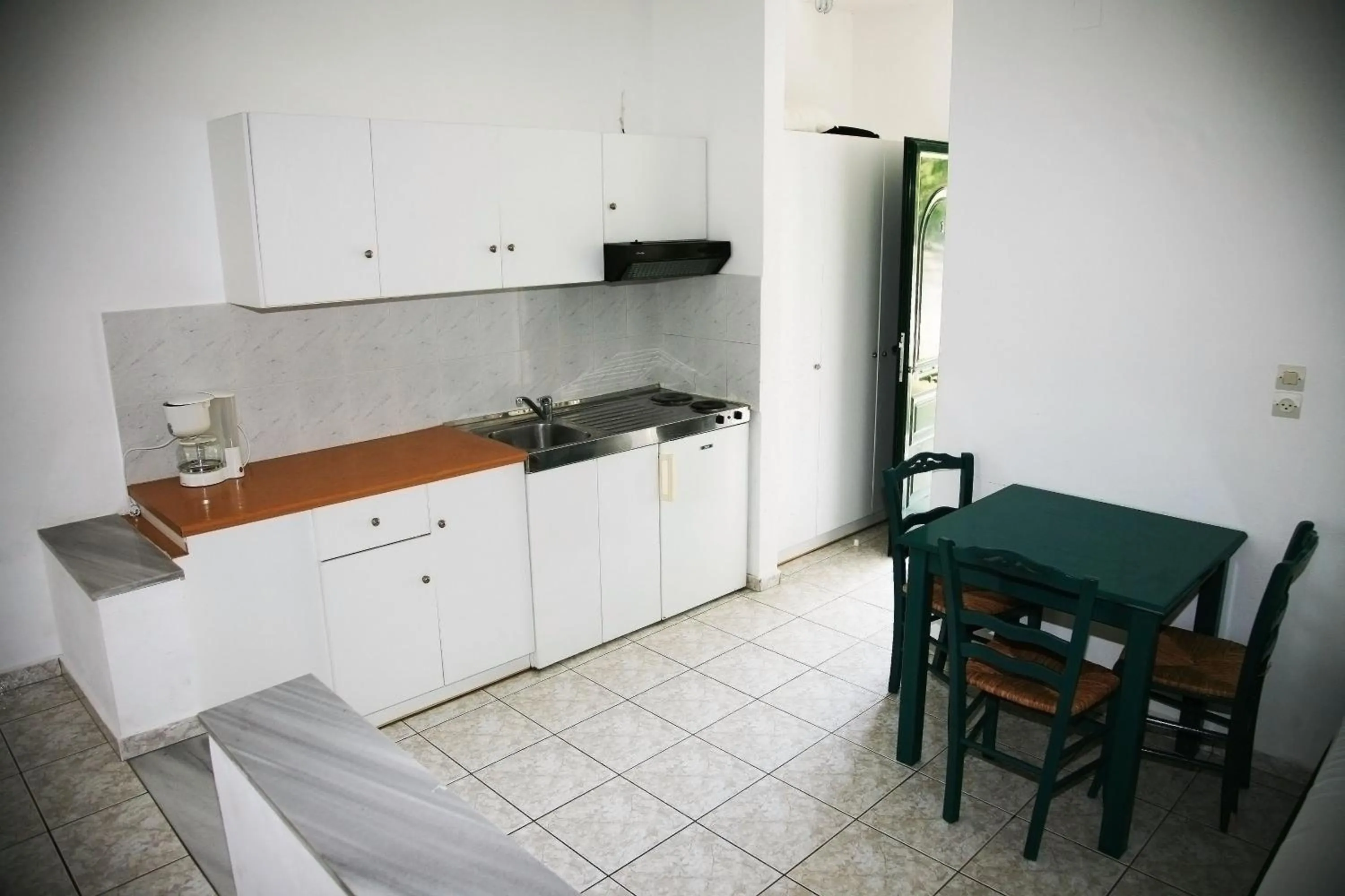 Kitchen or kitchenette in Zeus Hotel