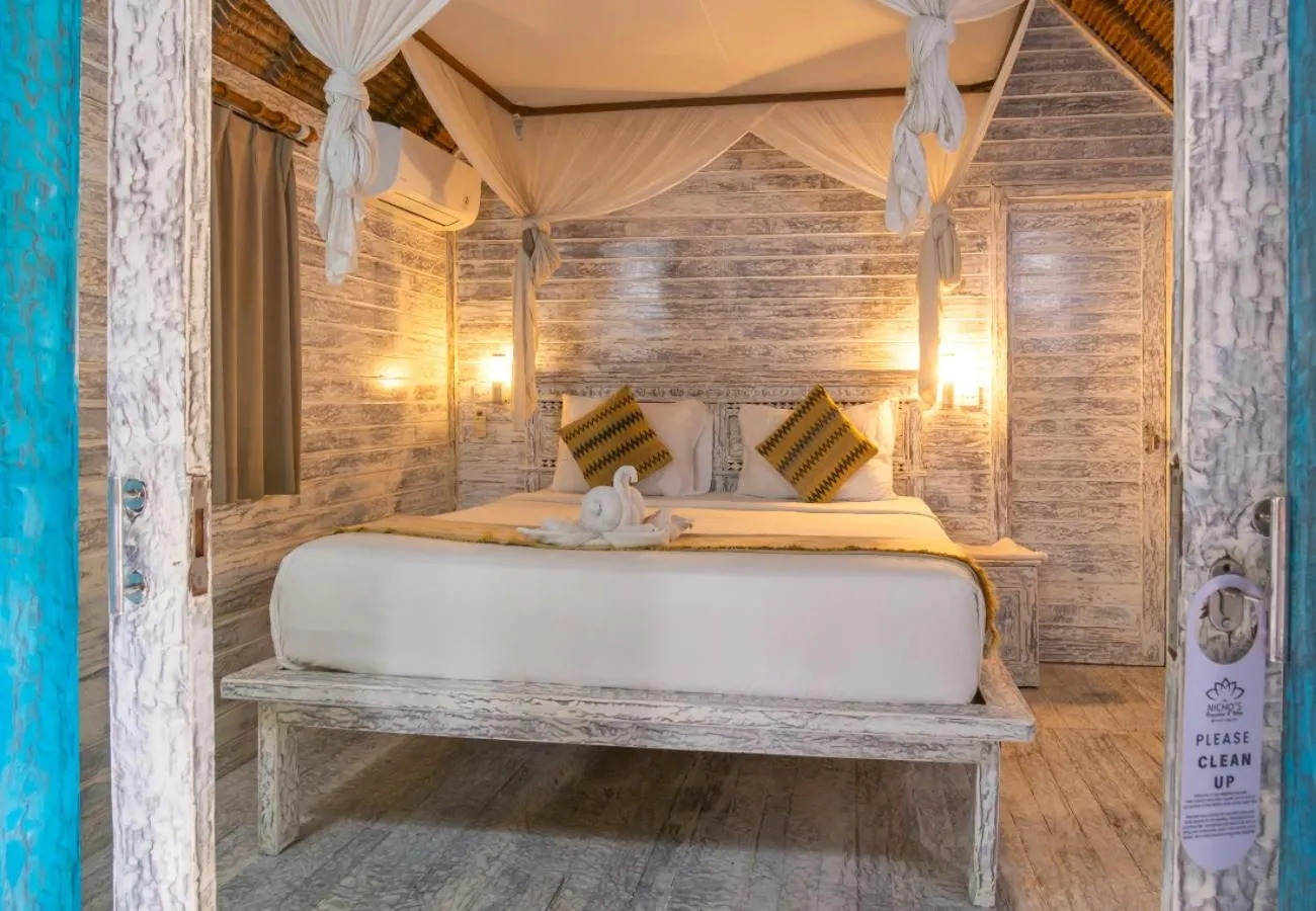 Bed in The Nichos Bungalows And Villas