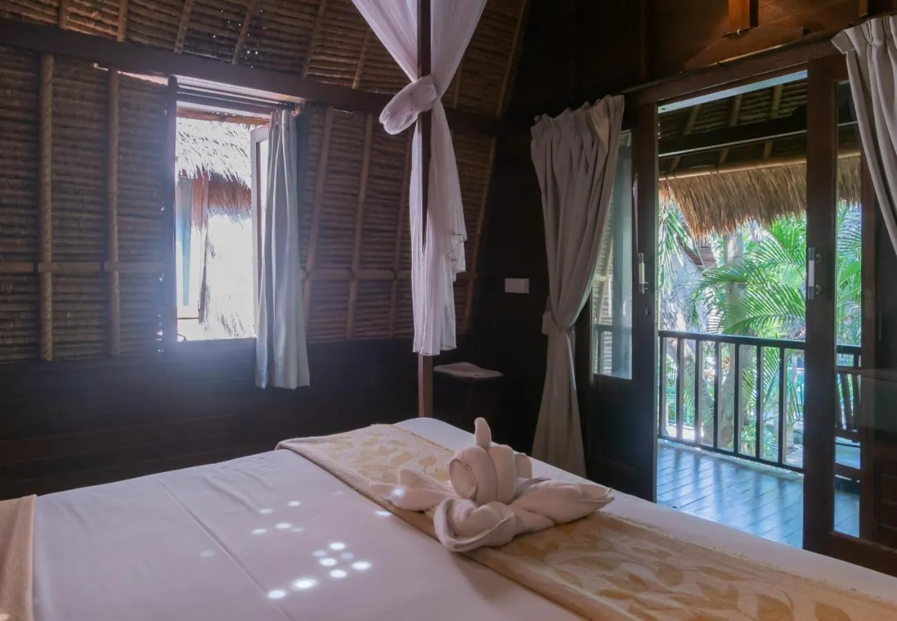 Bed in The Nichos Bungalows And Villas