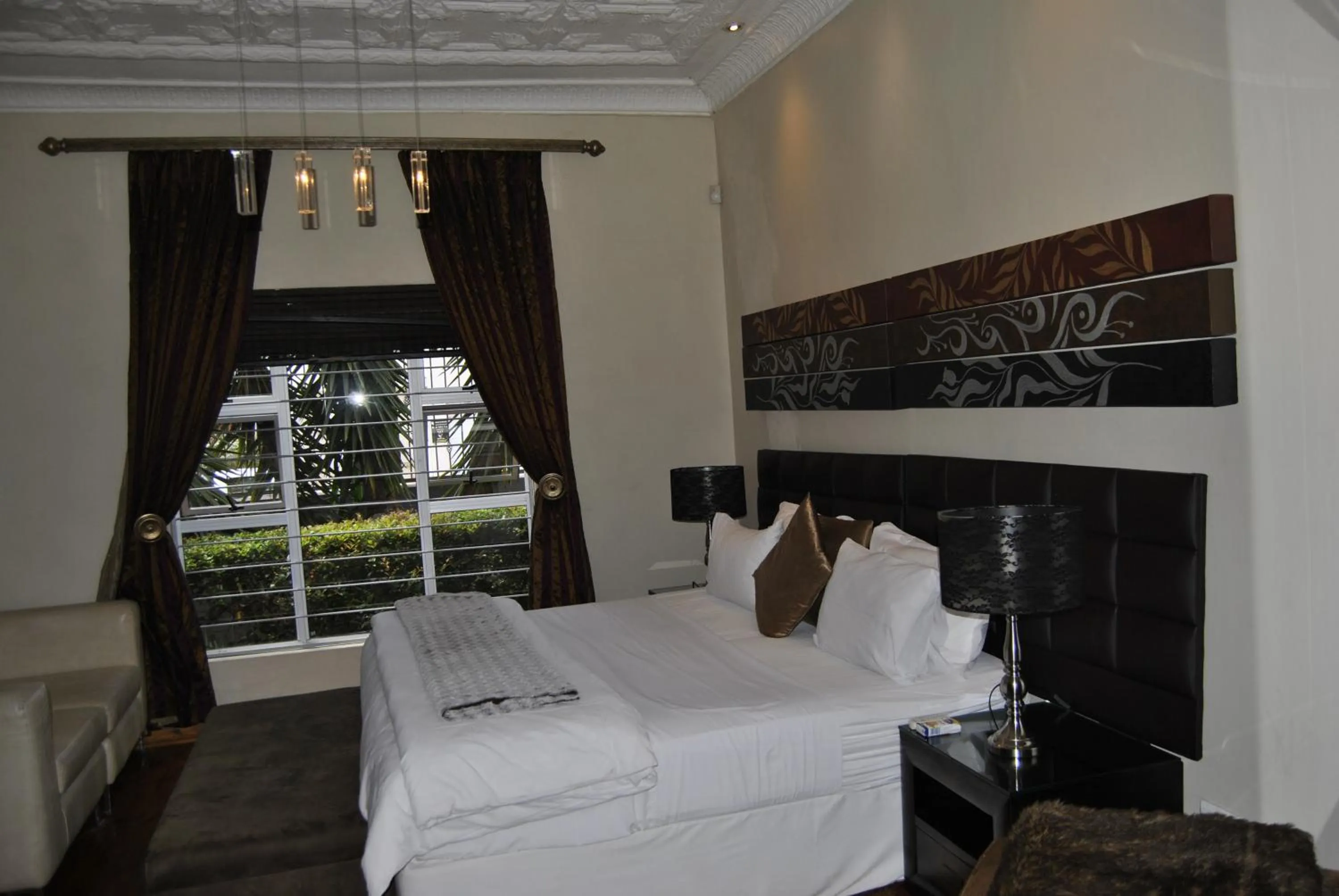 Bed in Saffron Guest House