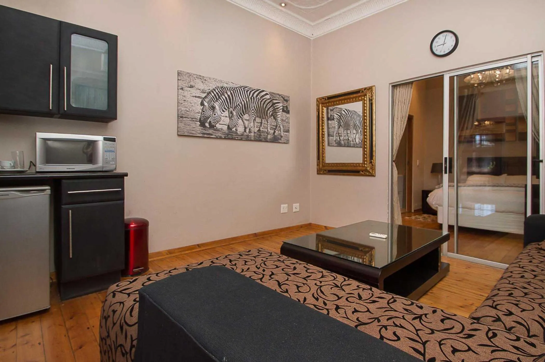 Seating area, Bed in Saffron Guest House