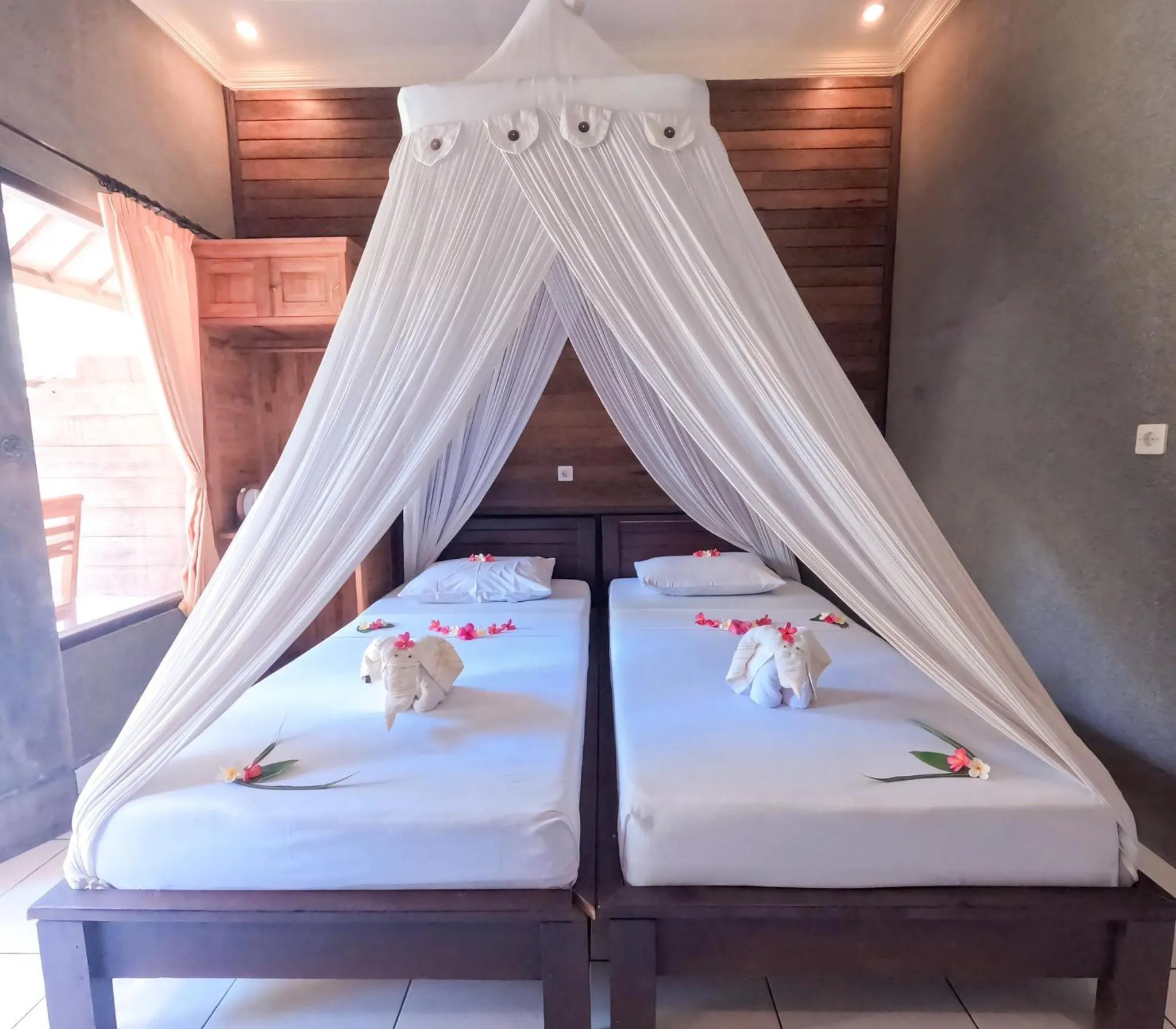 Bed in Suka Sari Cottages