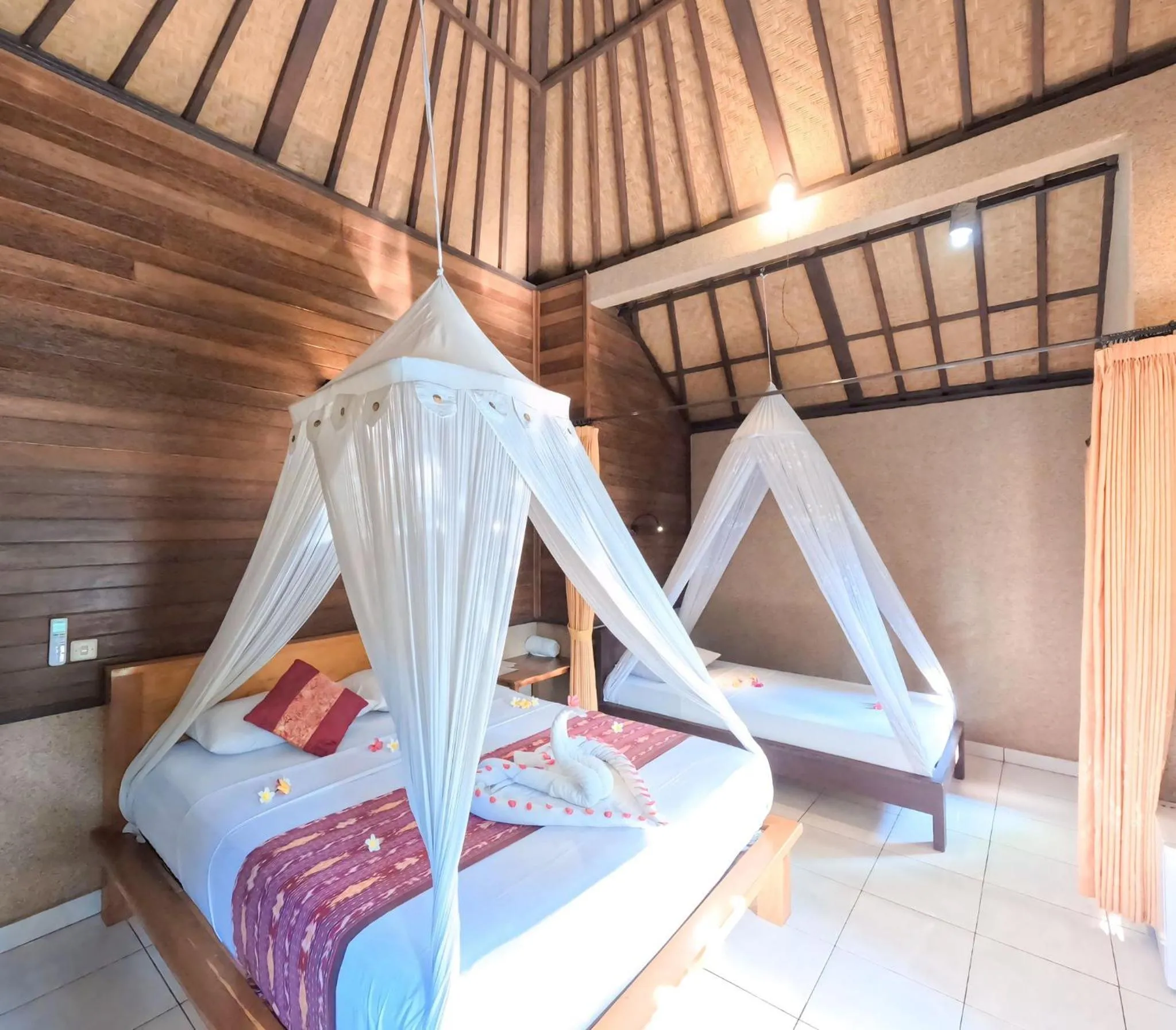 Bed in Suka Sari Cottages