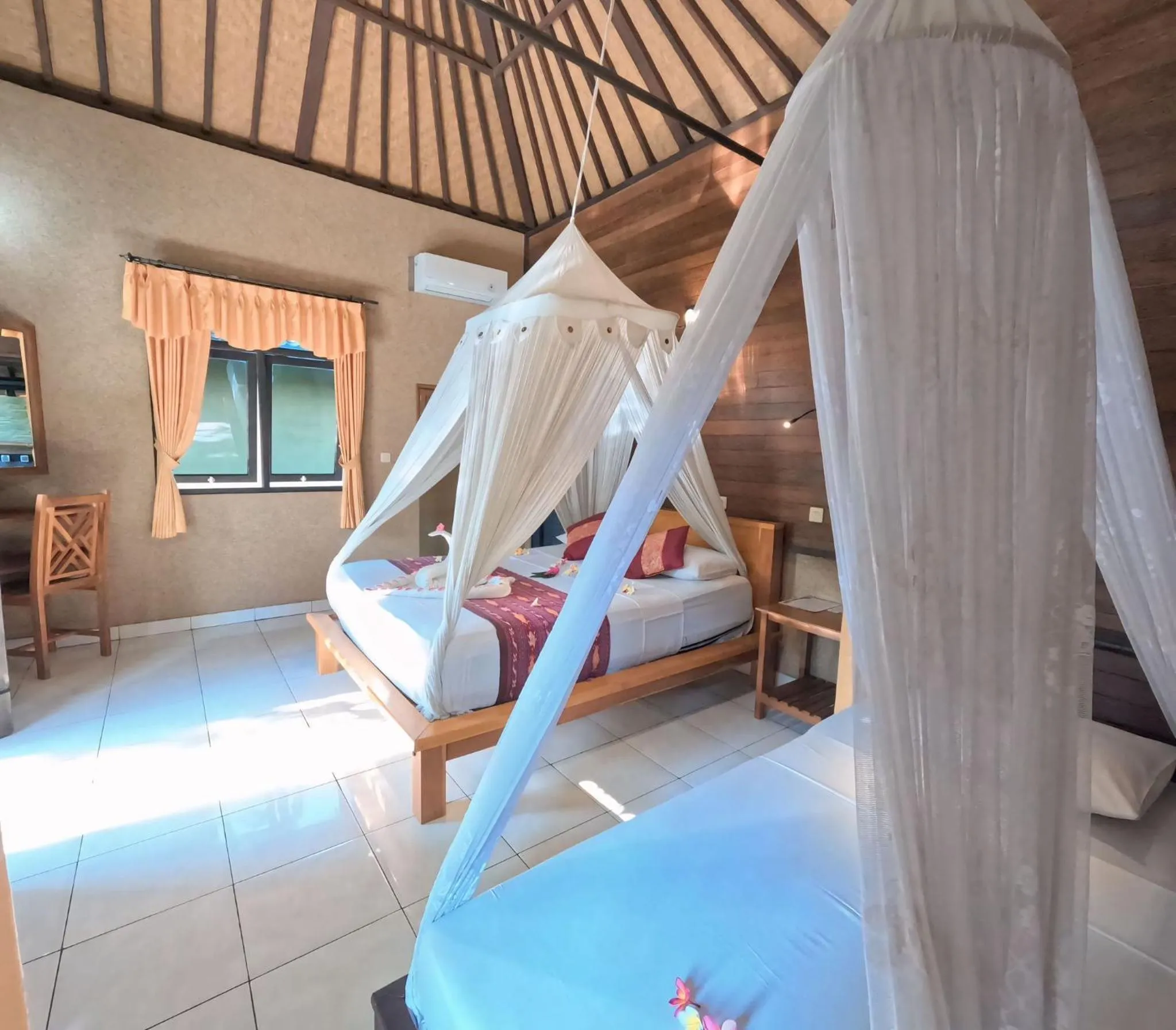 Bed in Suka Sari Cottages