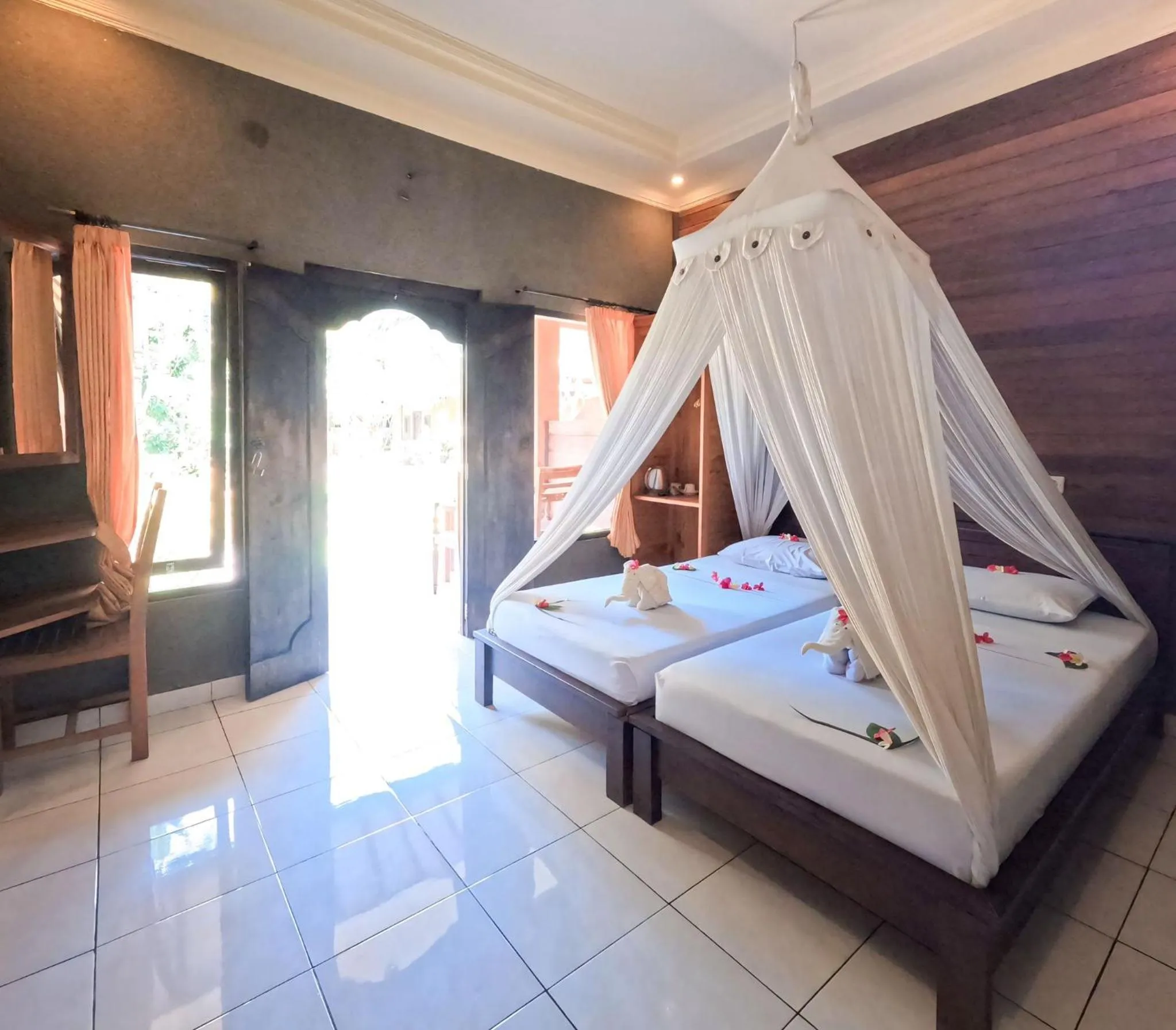 Bed in Suka Sari Cottages