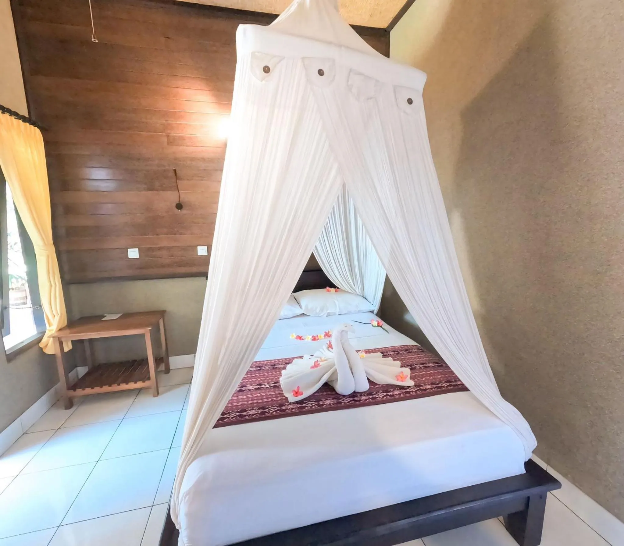 Bed in Suka Sari Cottages