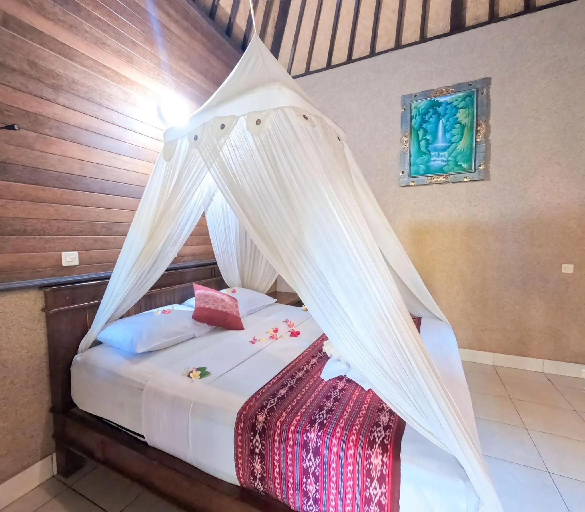 Bed in Suka Sari Cottages