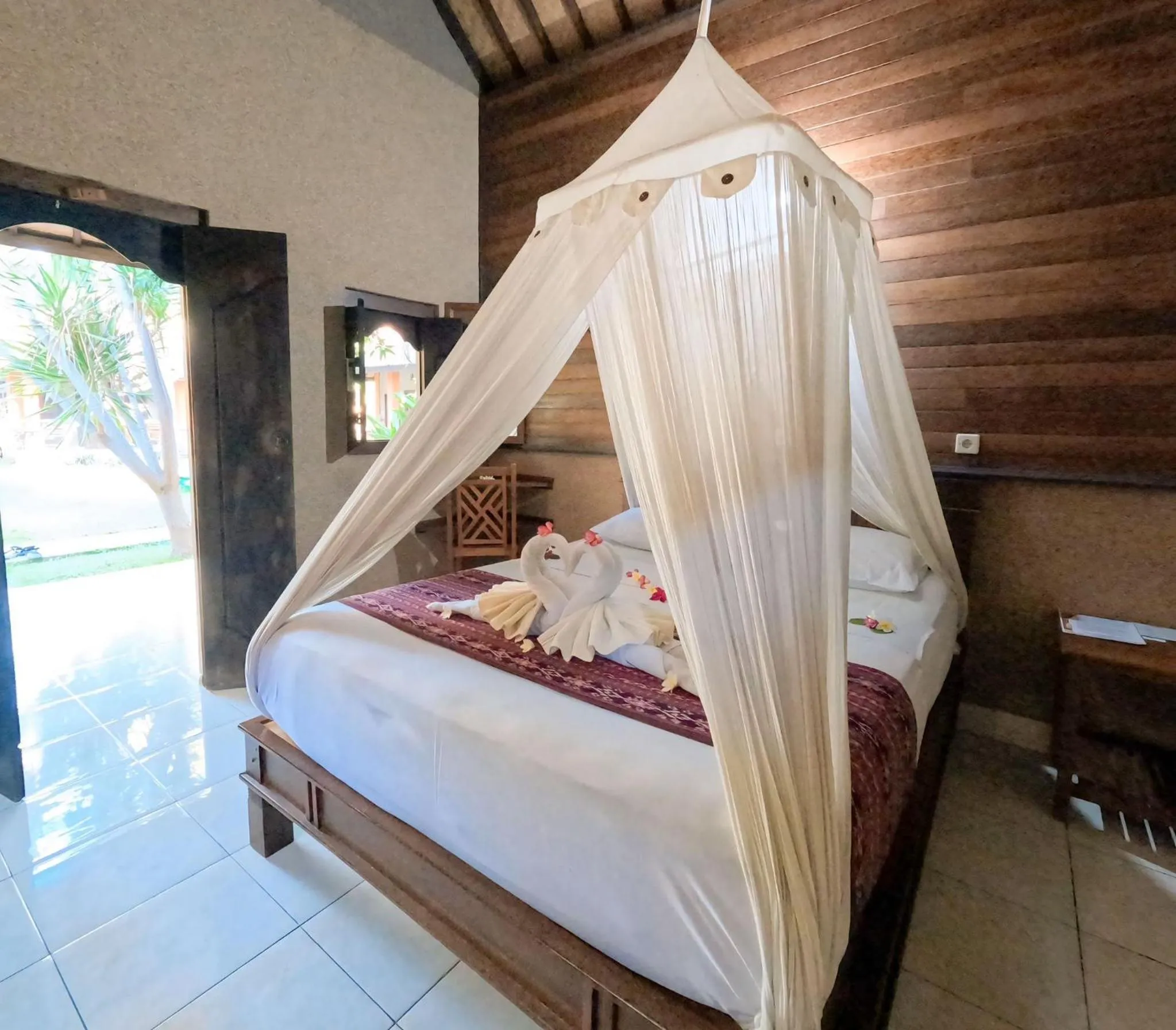 Bed in Suka Sari Cottages