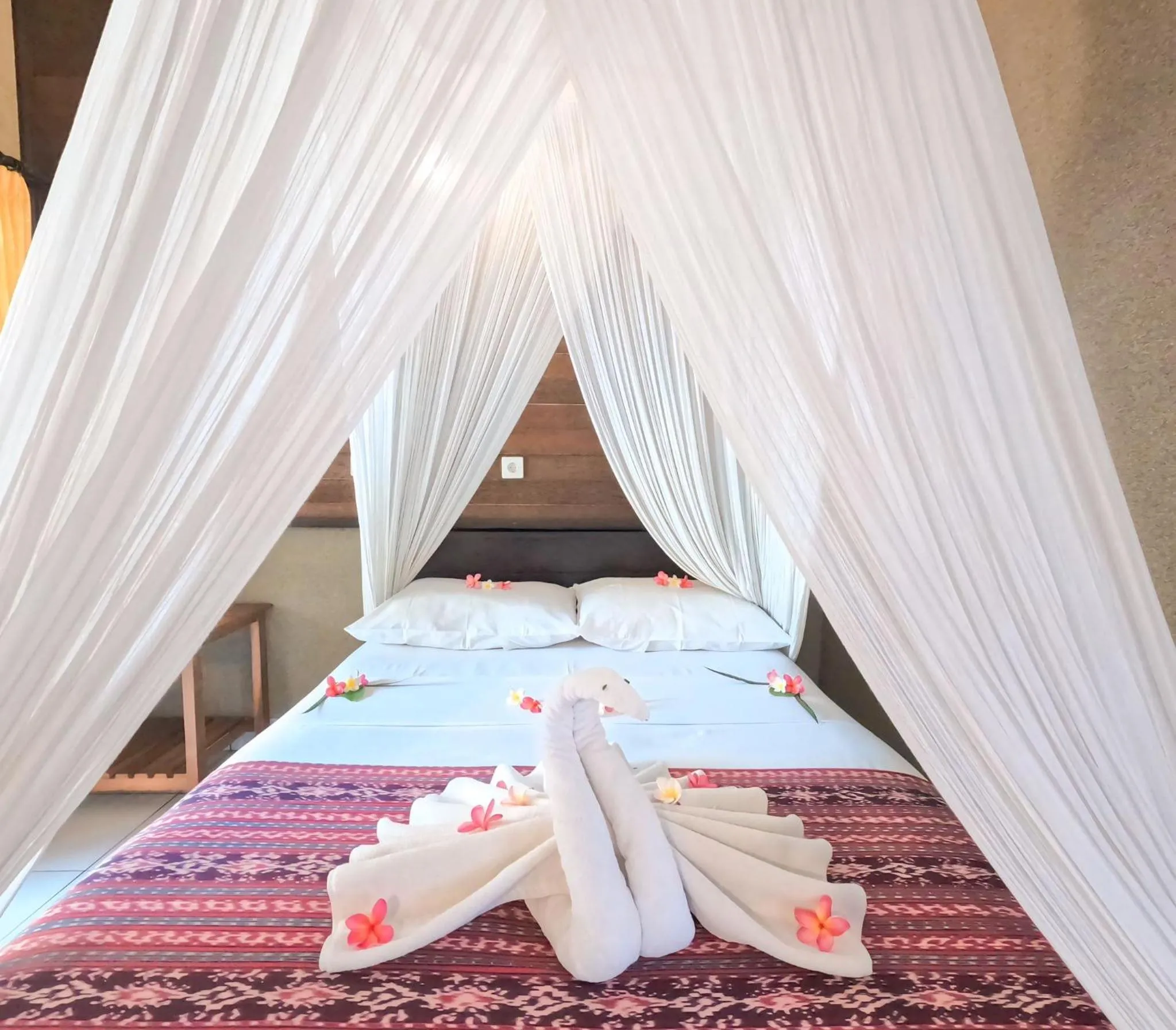 Bed in Suka Sari Cottages