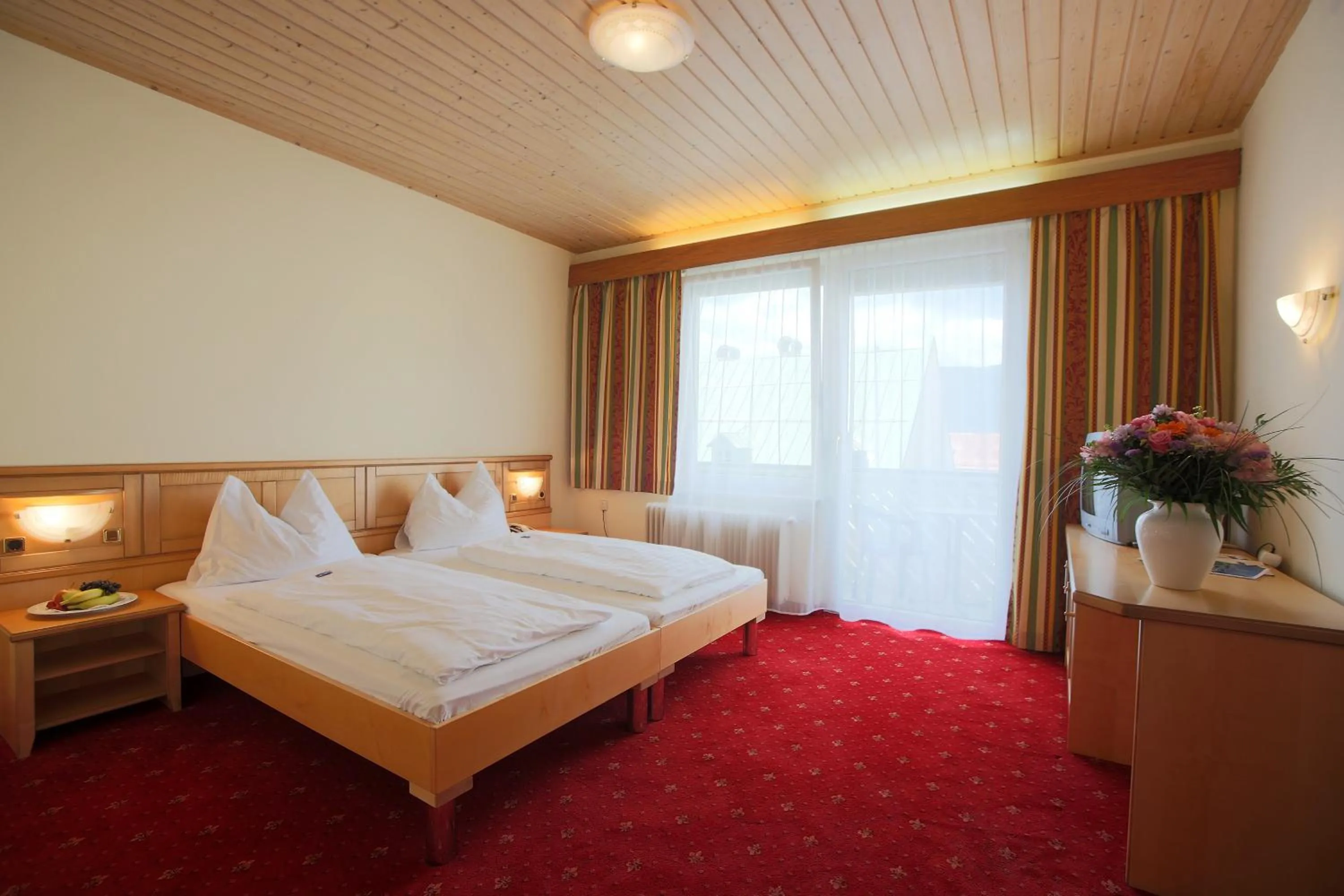 Bed in AKTIVHOTEL Weisser Hirsch