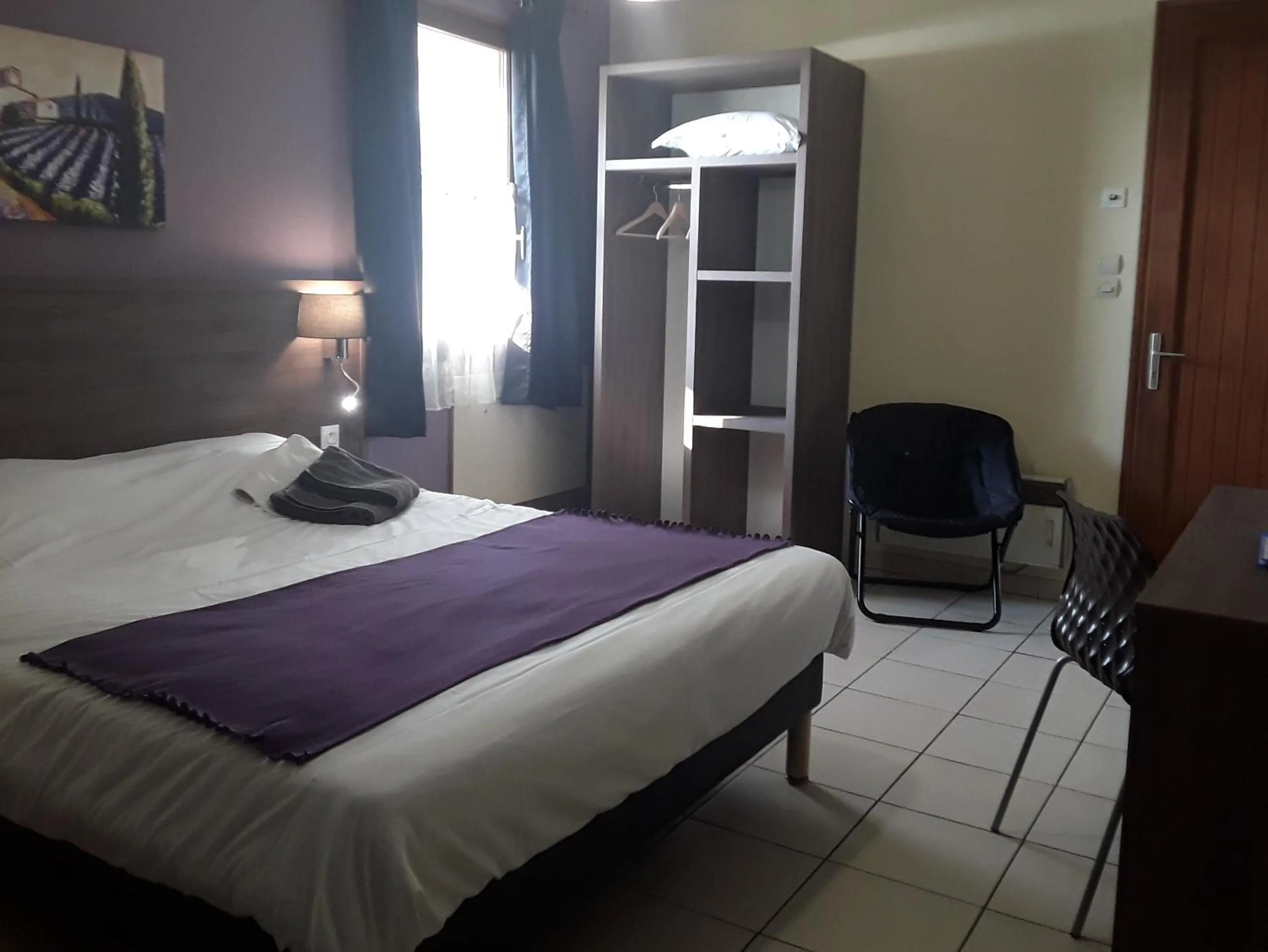 Bed in Relais Motel de Maisonnay