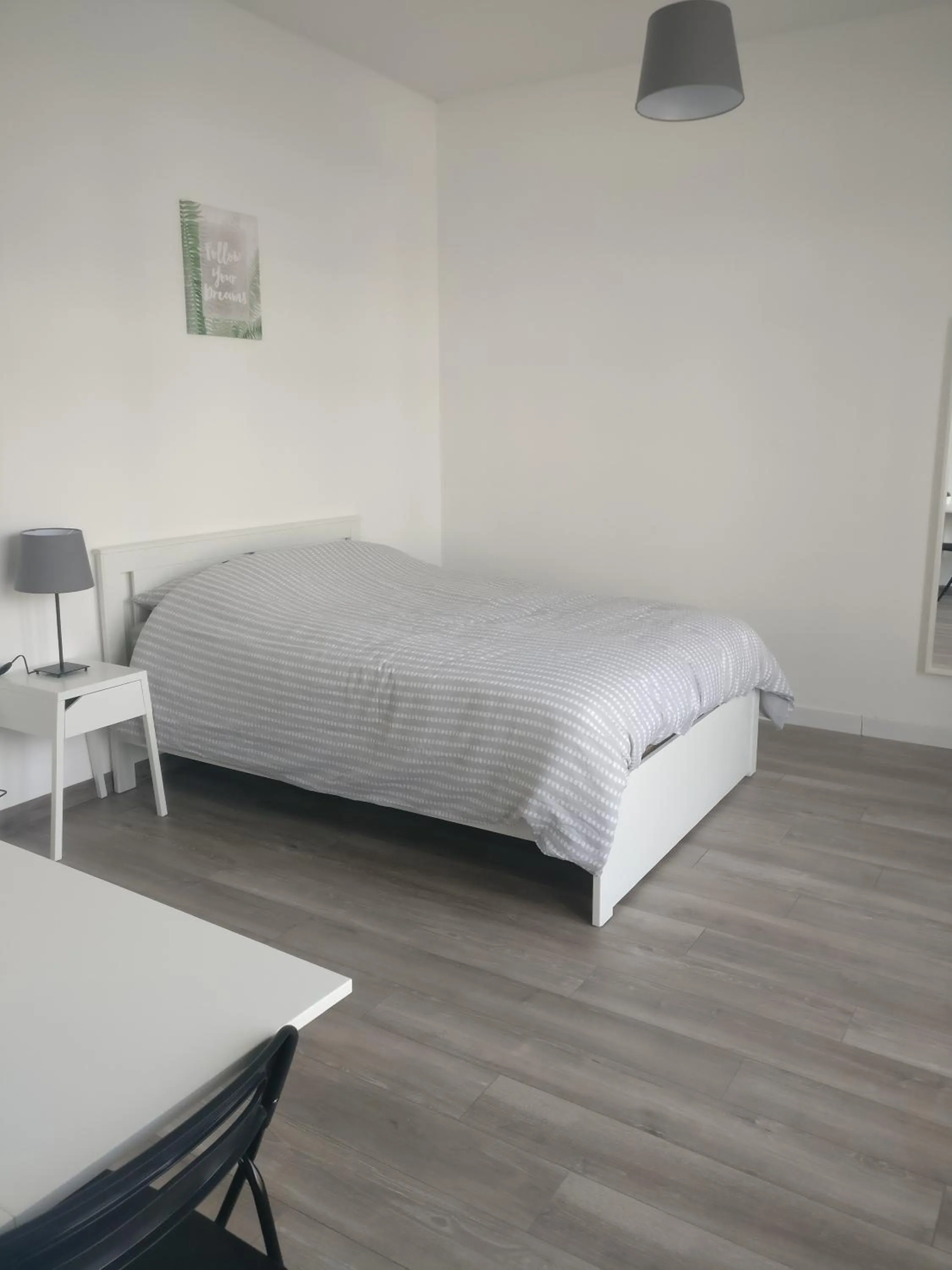 Bed in Appart Hôtel L'Angélique