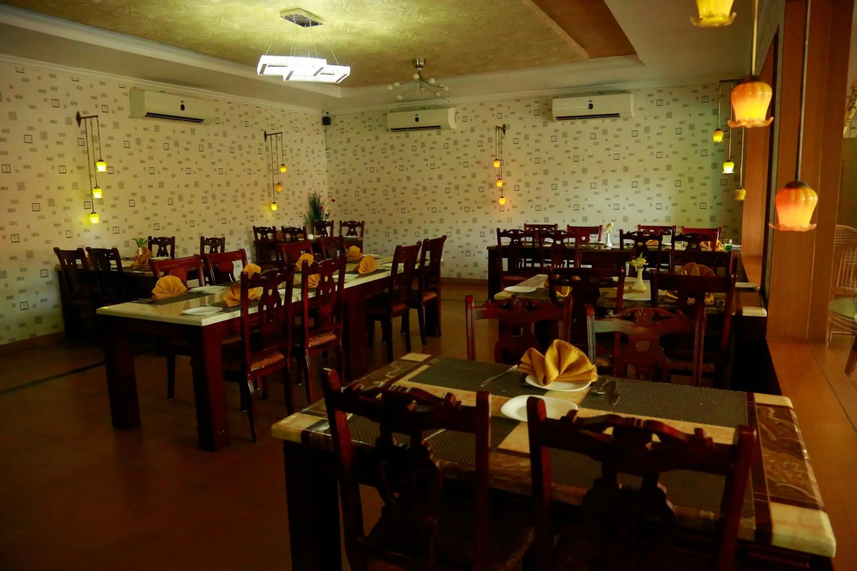 Dining area in SAJ Earth Resort & Convention Center , Kochi