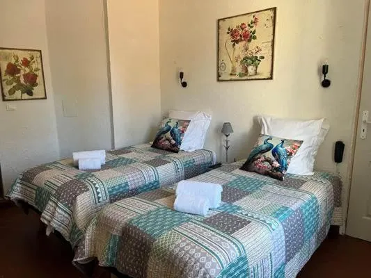 Bedroom in La Villa Roseraie , Hôtel Familial OUVERT TOUTE L ANNEE