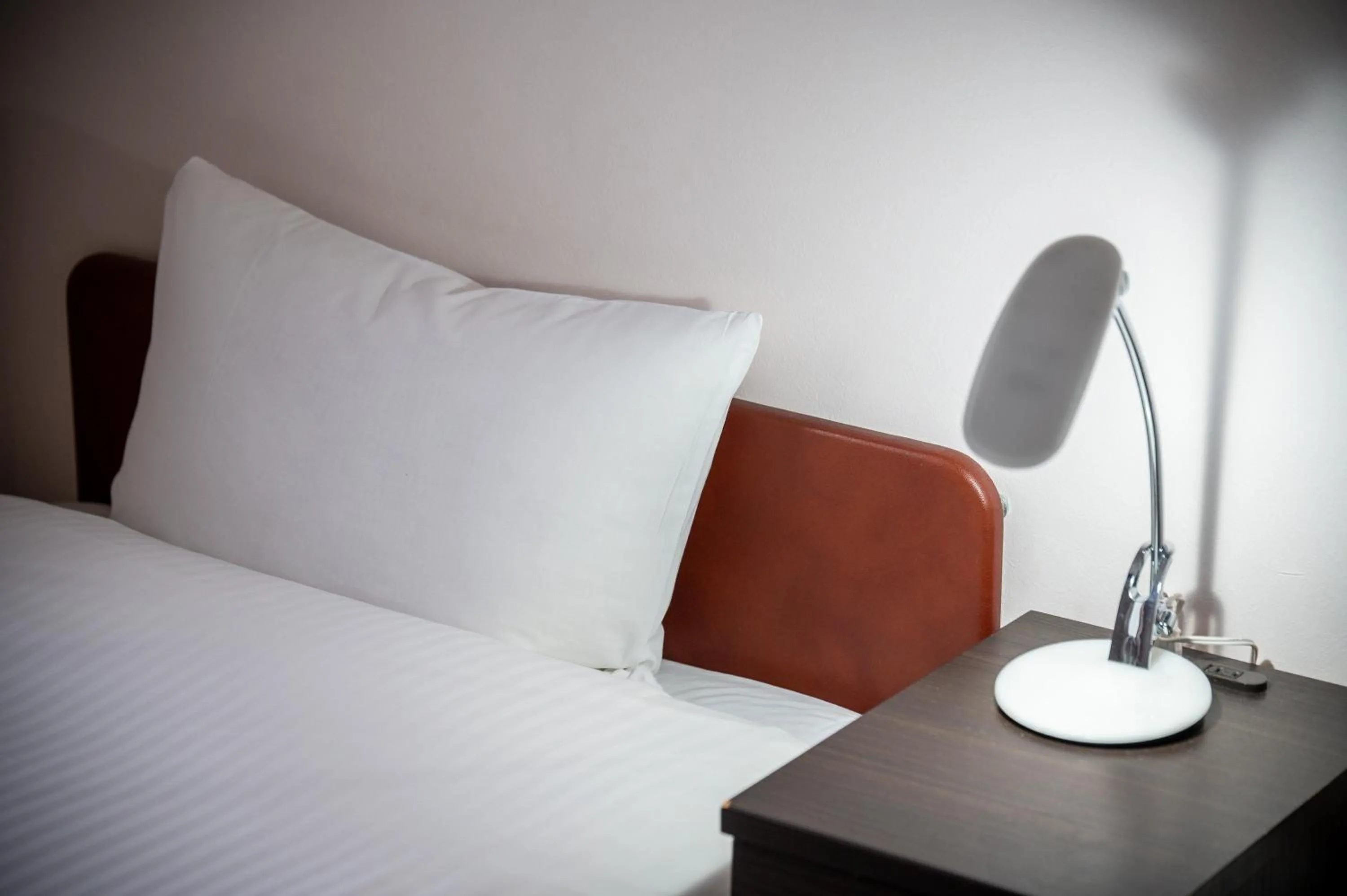 Bed in Kagoshima Daiichi Hotel Kamoike