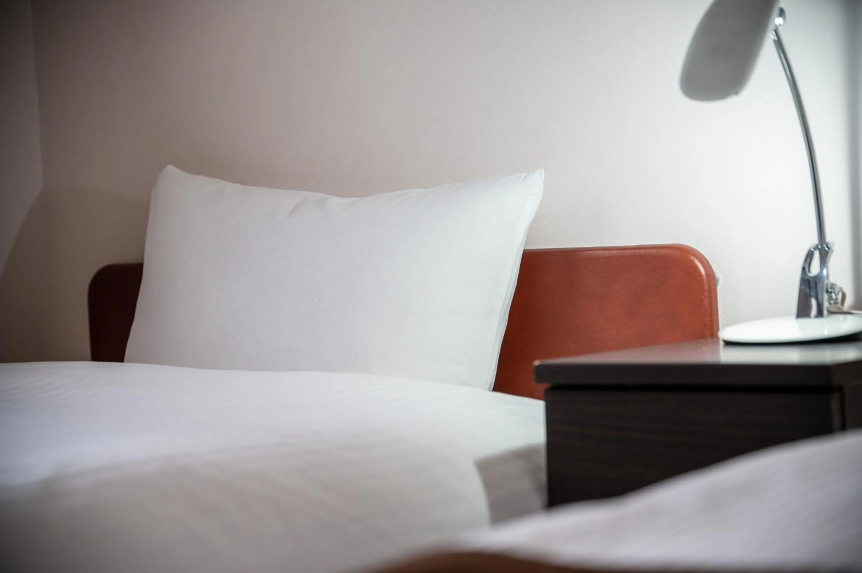 Bed in Kagoshima Daiichi Hotel Kamoike