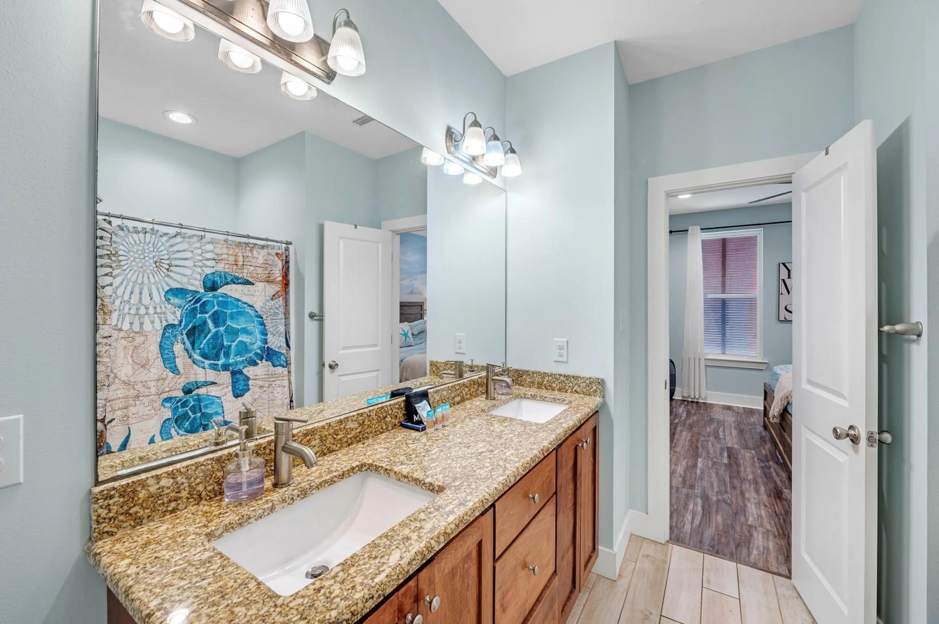 Bathroom in TRUE BLUE-Coastal cottage-3 min walk to beach! POOL!