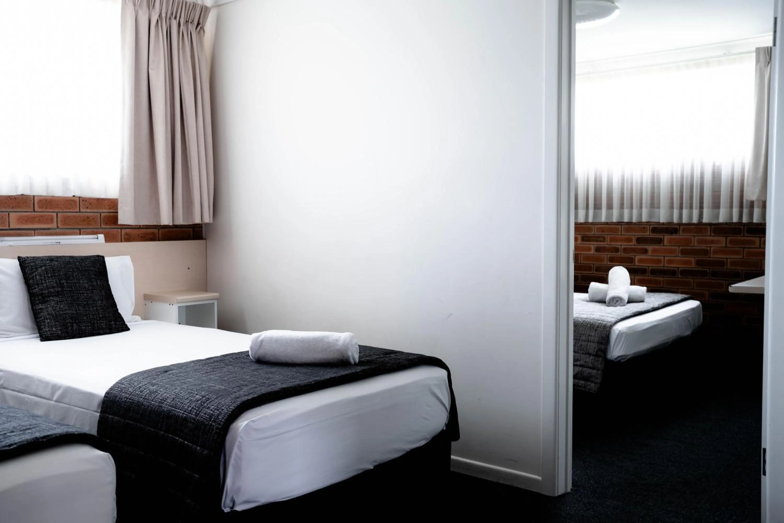 Bed in Buckaroo Motor Inn