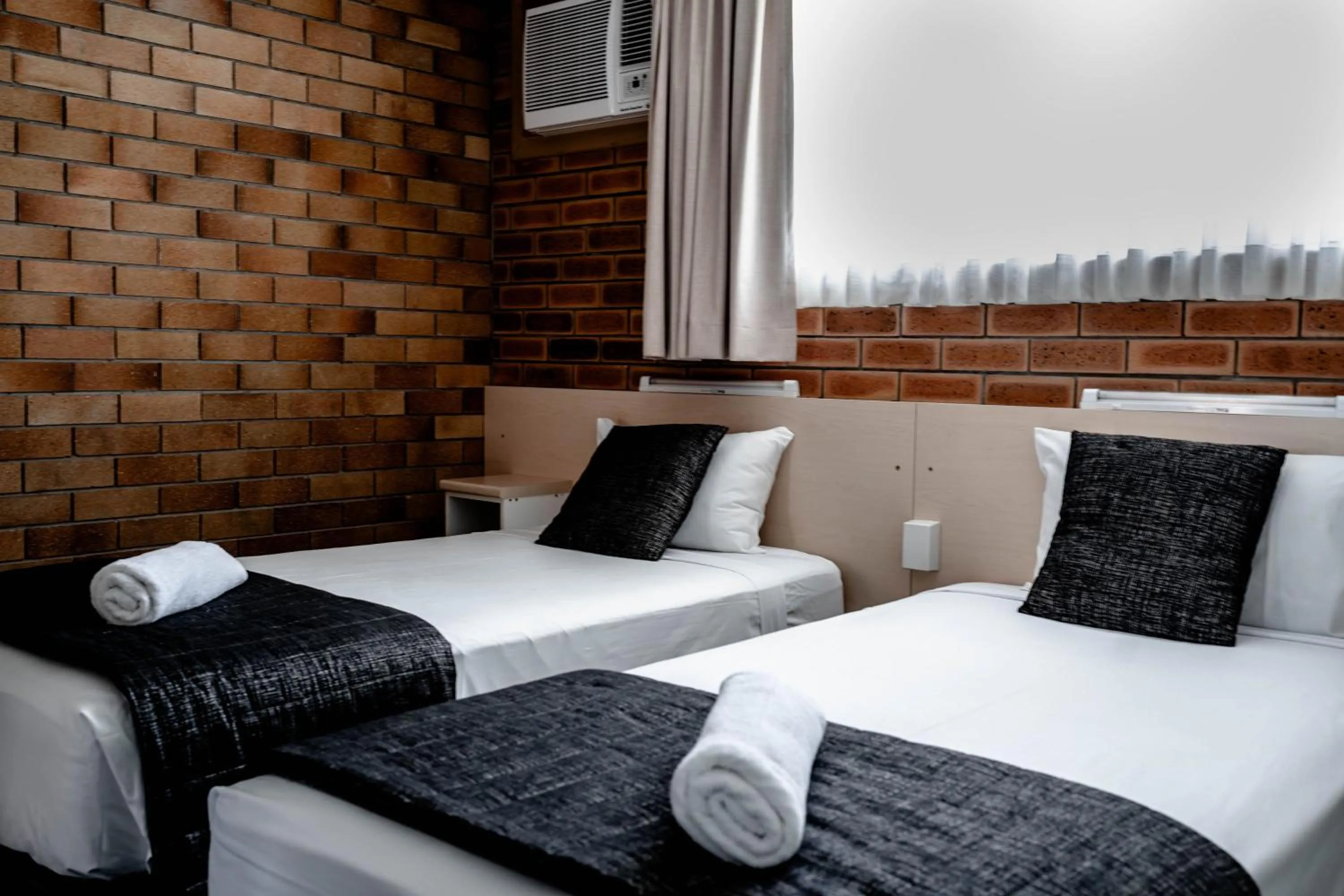 Bed in Buckaroo Motor Inn