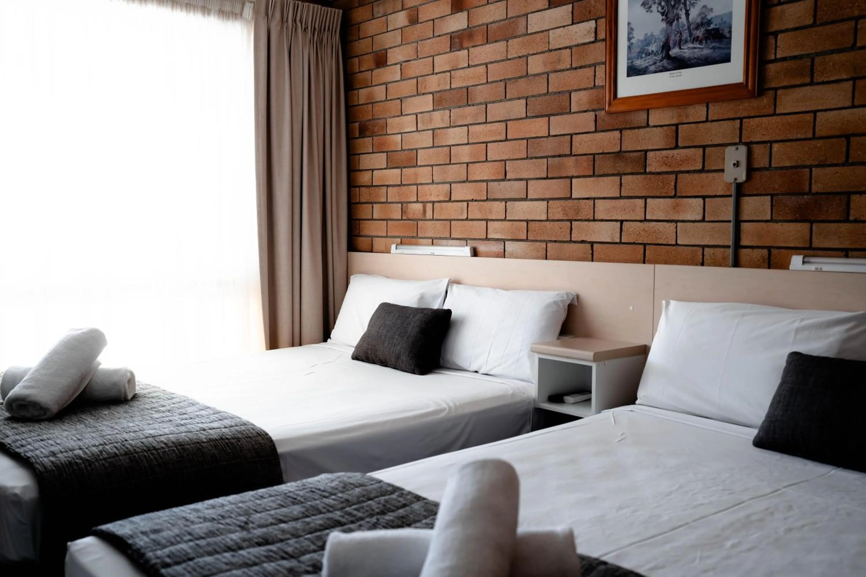 Bed in Buckaroo Motor Inn