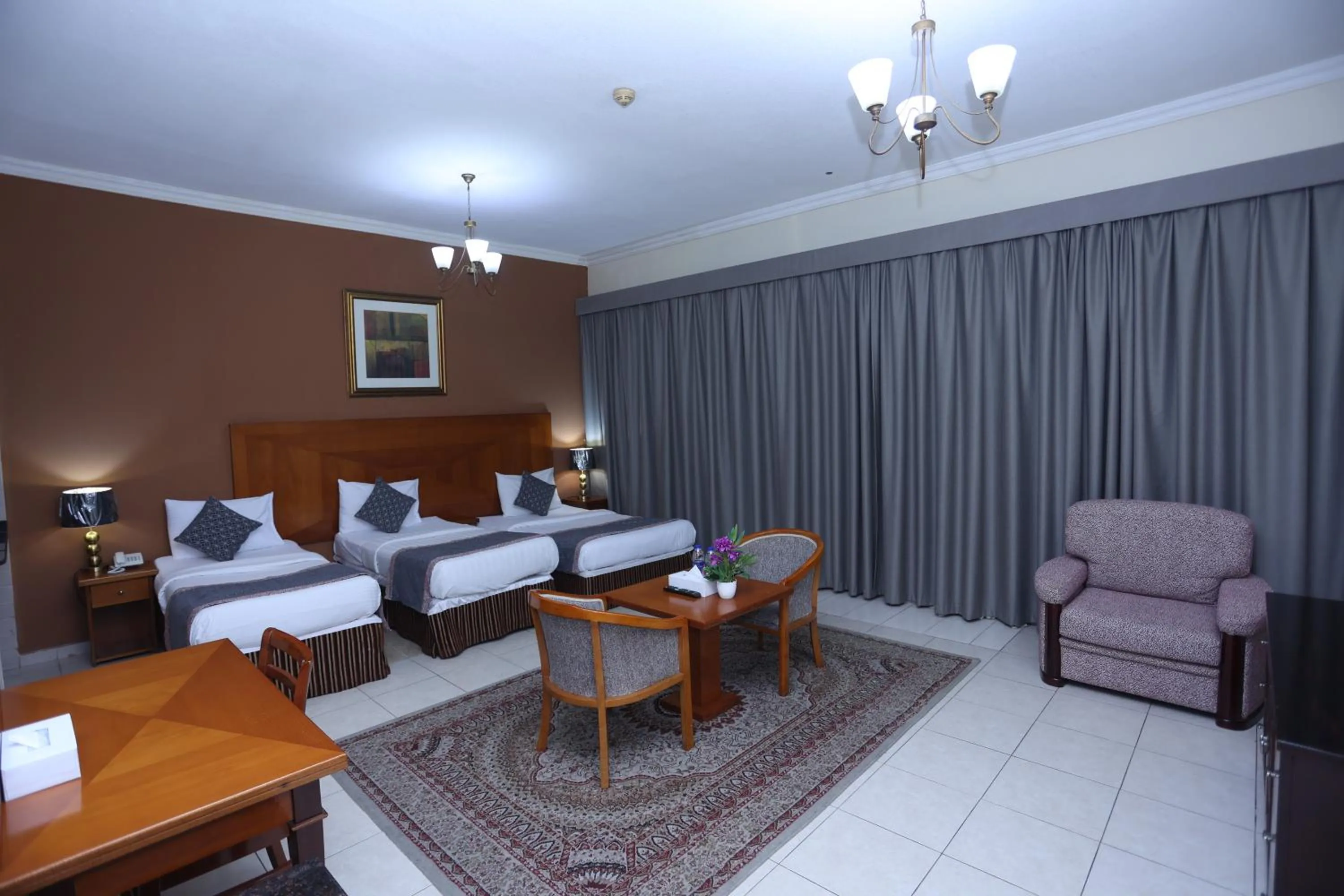 Bed in Icon Hotel Apartments