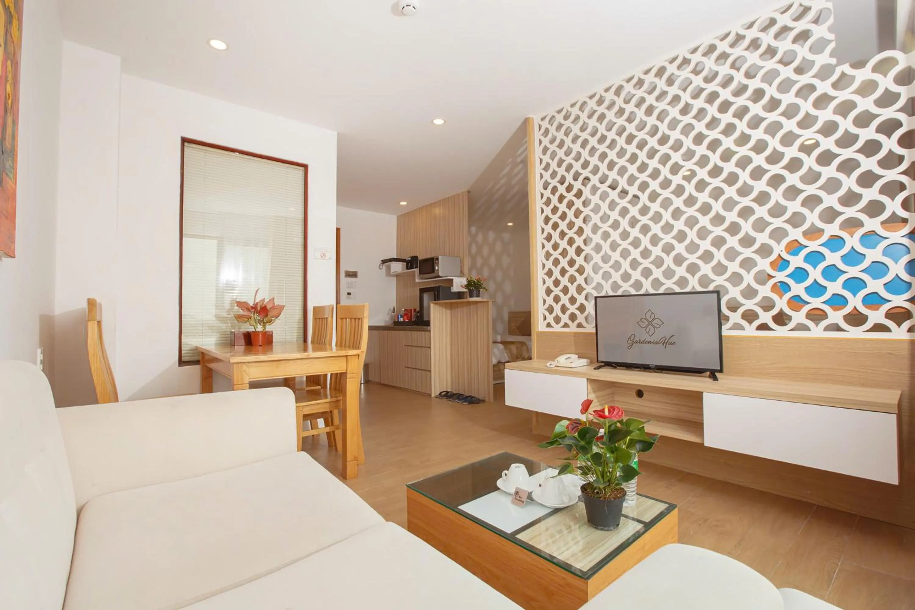 Living room, Bed in Gardenia Hue Hotel