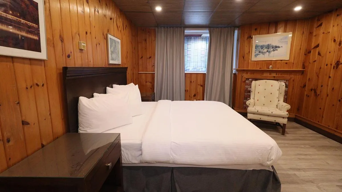 Bed in Algonquin Lakeside Inn