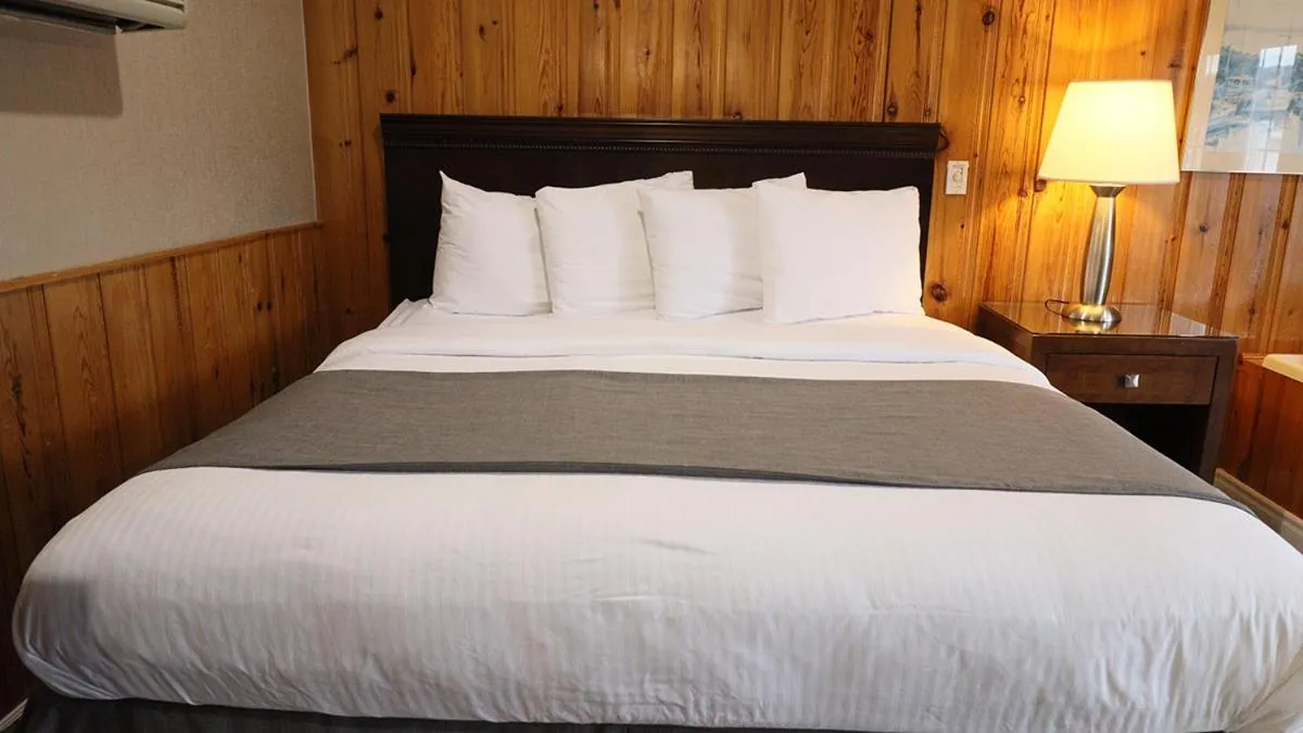 Bed in Algonquin Lakeside Inn