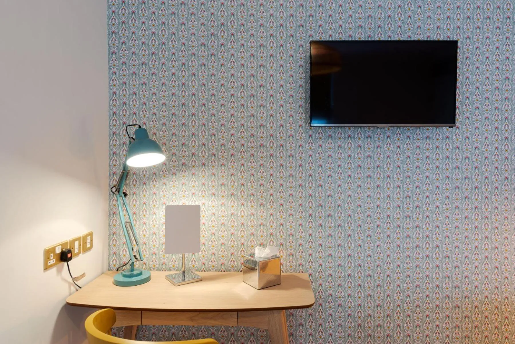 Communal lounge/ TV room in The Clarence Boutique Rooms